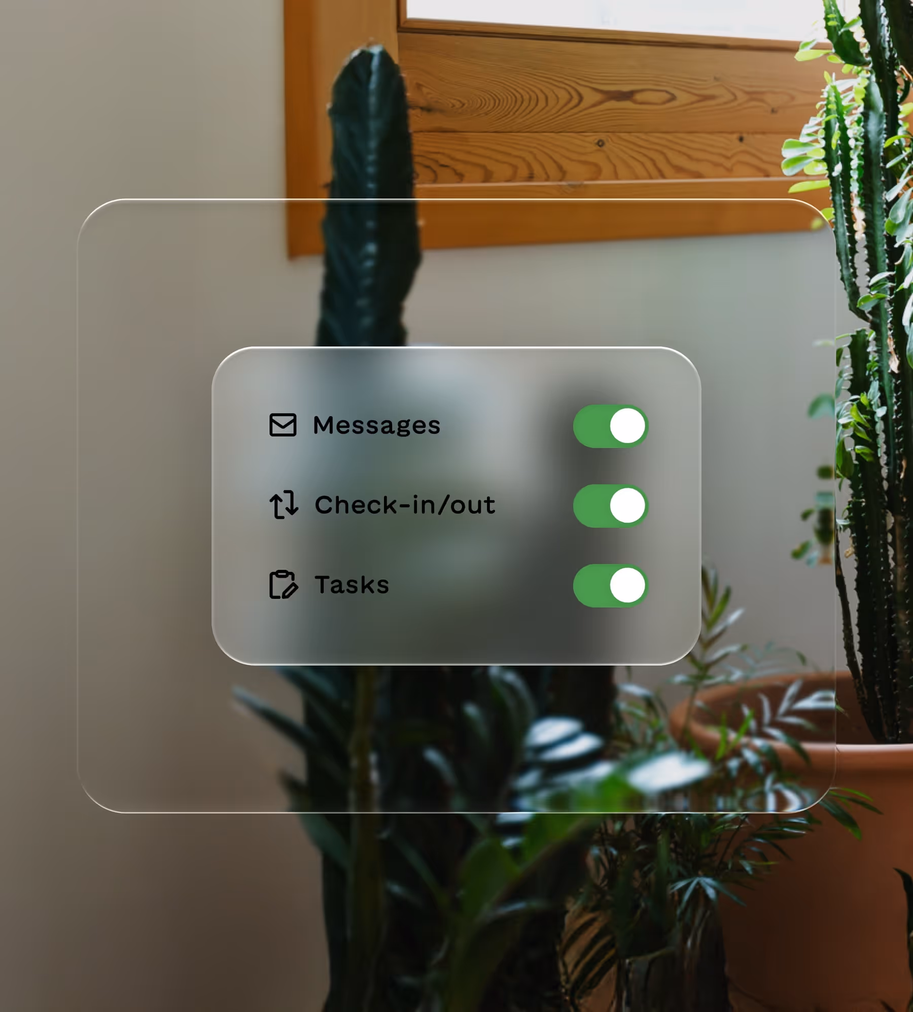 Toggle switches turned on for Messages, Check-in/out, and Tasks over a blurred background with potted plants.