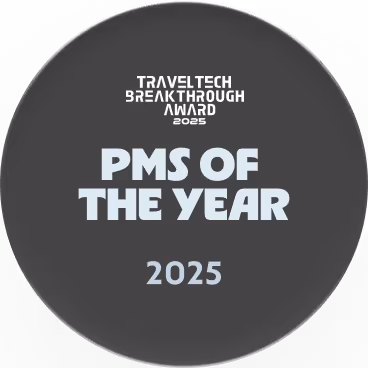 TravelTech Breakthrough Award 2025 for PMS of the Year on a dark circular plaque.
