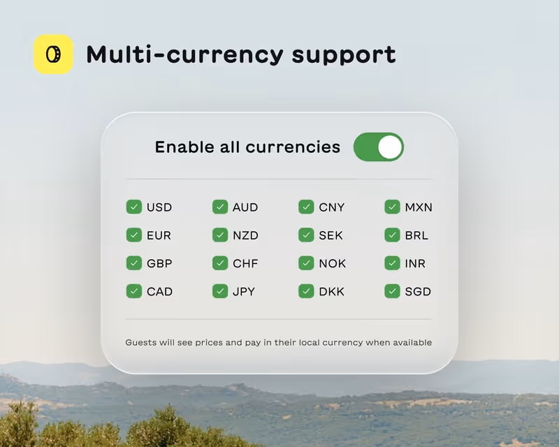 Interface showcasing multi-currency support with a toggle enabled and checkboxes for 16 global currencies on a scenic background.