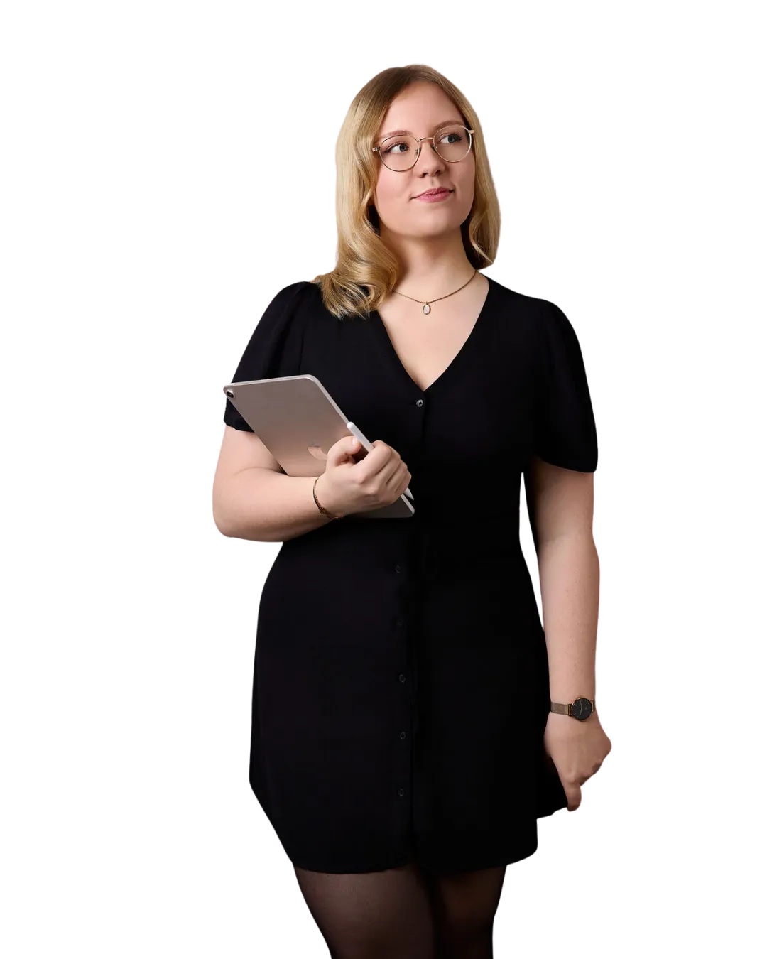 Woman with blonde hair and glasses holds a tablet against a black background.