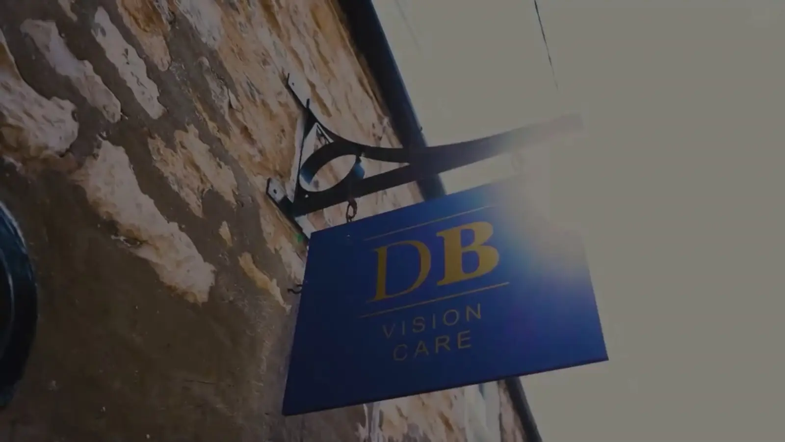 Optician fitting glasses for a patient at David Burghardt Vision Care