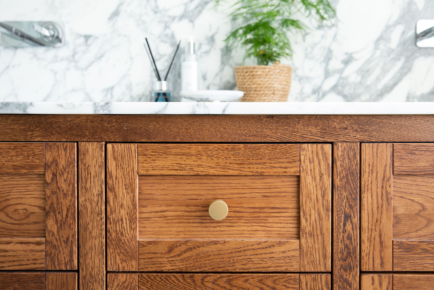 Marble en-suite bathroom with rich wood vanity and understated luxury — Lorna Smith Interiors, Midhurst
