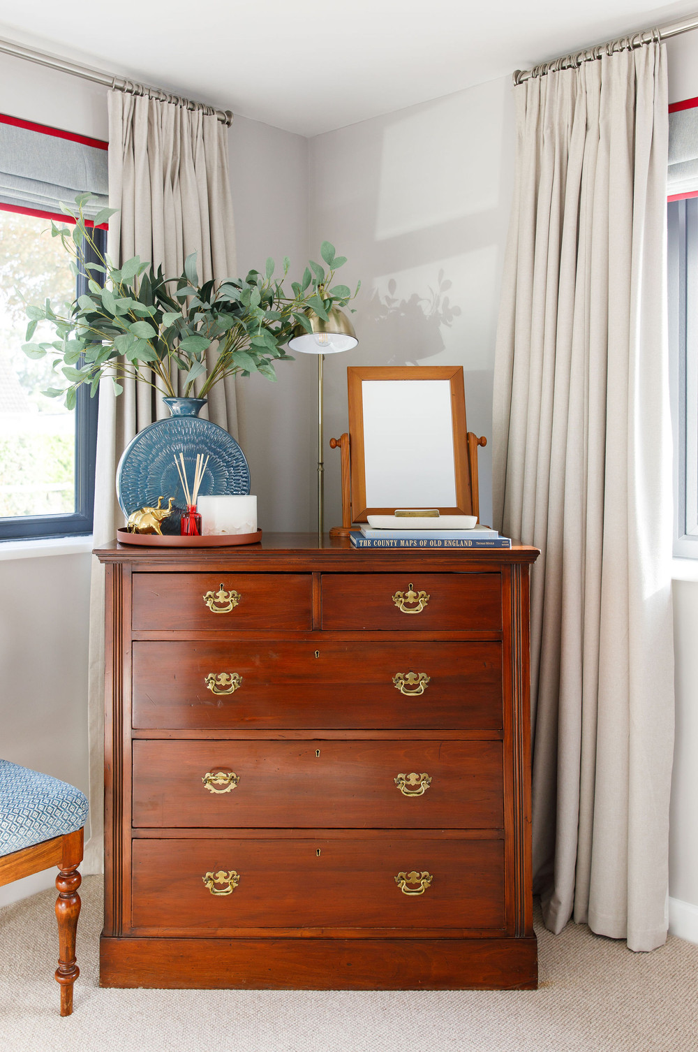 Red master bedroom detail with elegant styling — Lorna Smith Interiors