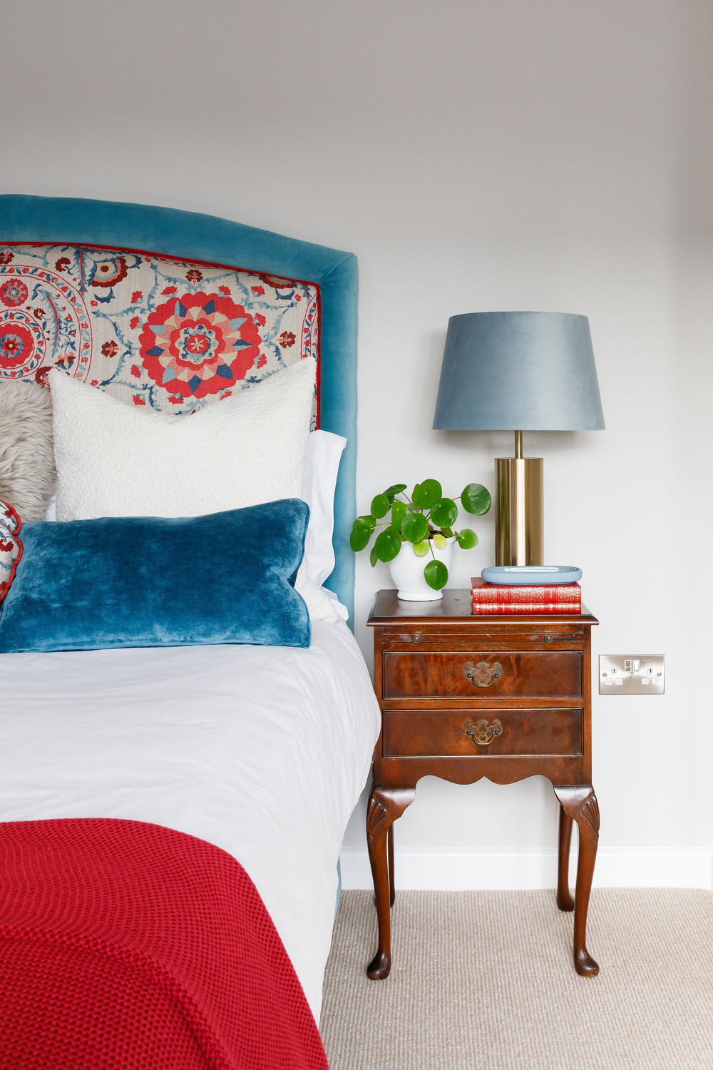 Red master bedroom vignette with fresh elegance — Lorna Smith Interiors, Petworth