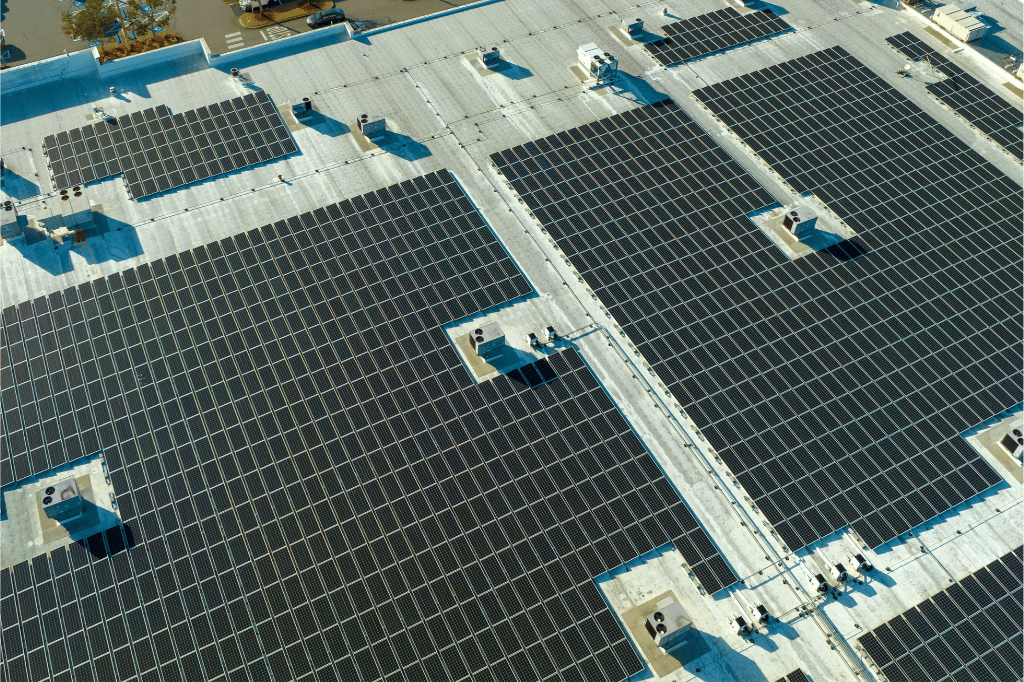 An array of solar panels on a commercial building
