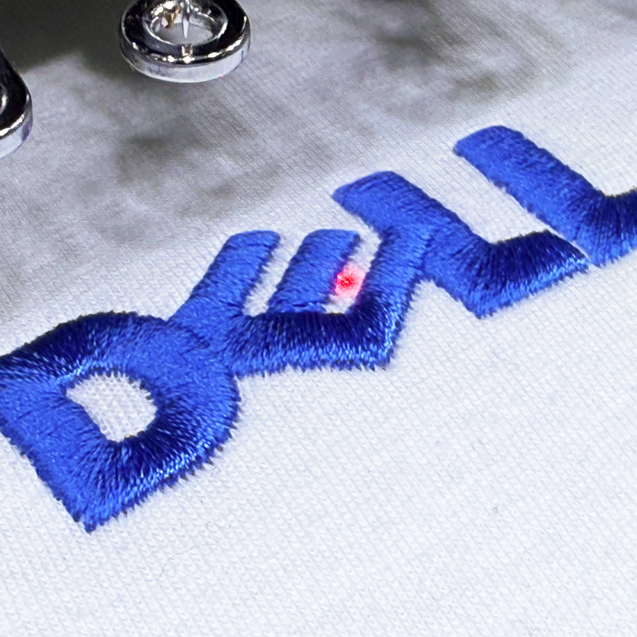 Custom embroidered company logo on branded t-shirt