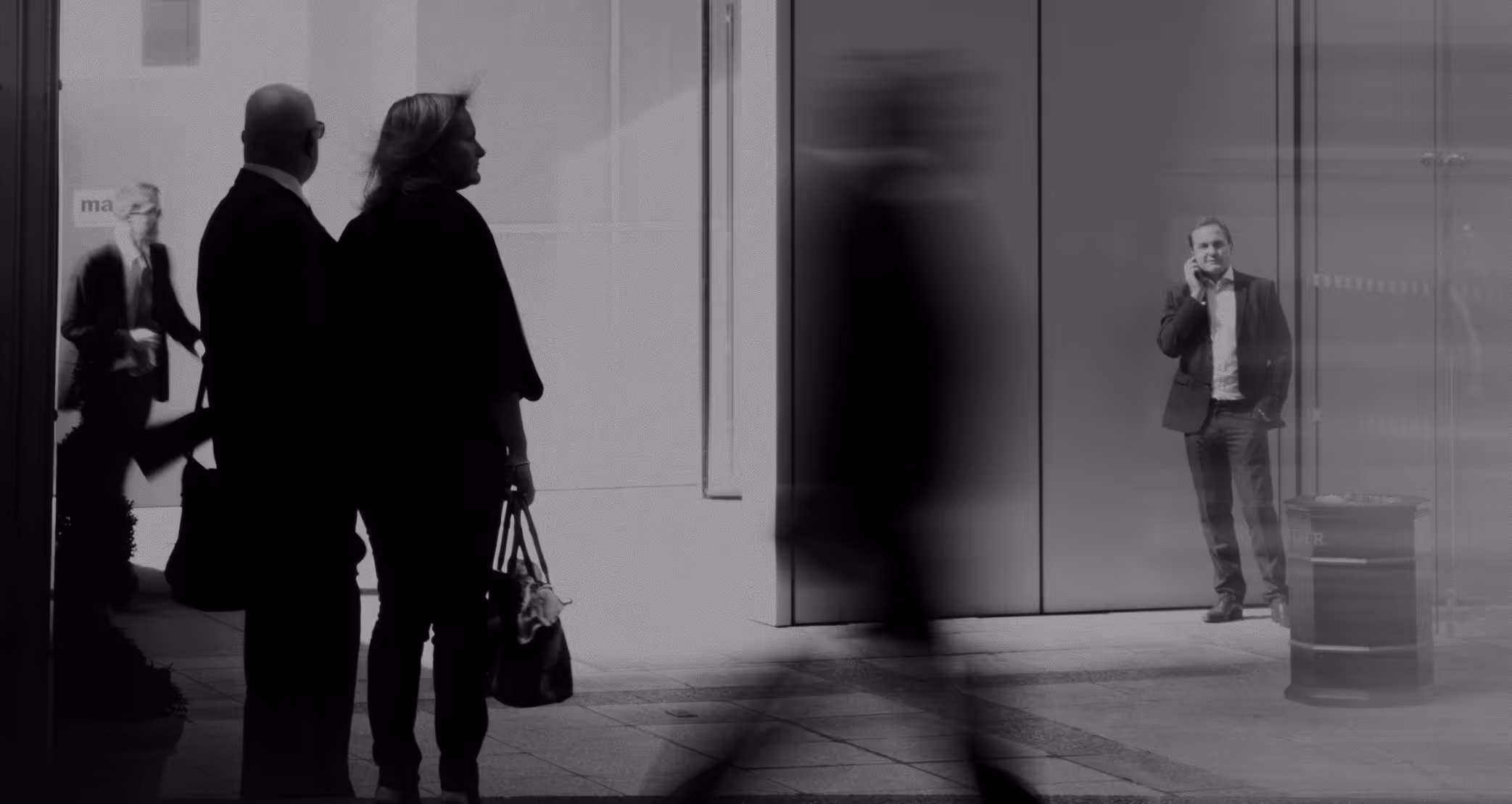 Abstract blurry still of people walking on the street.
