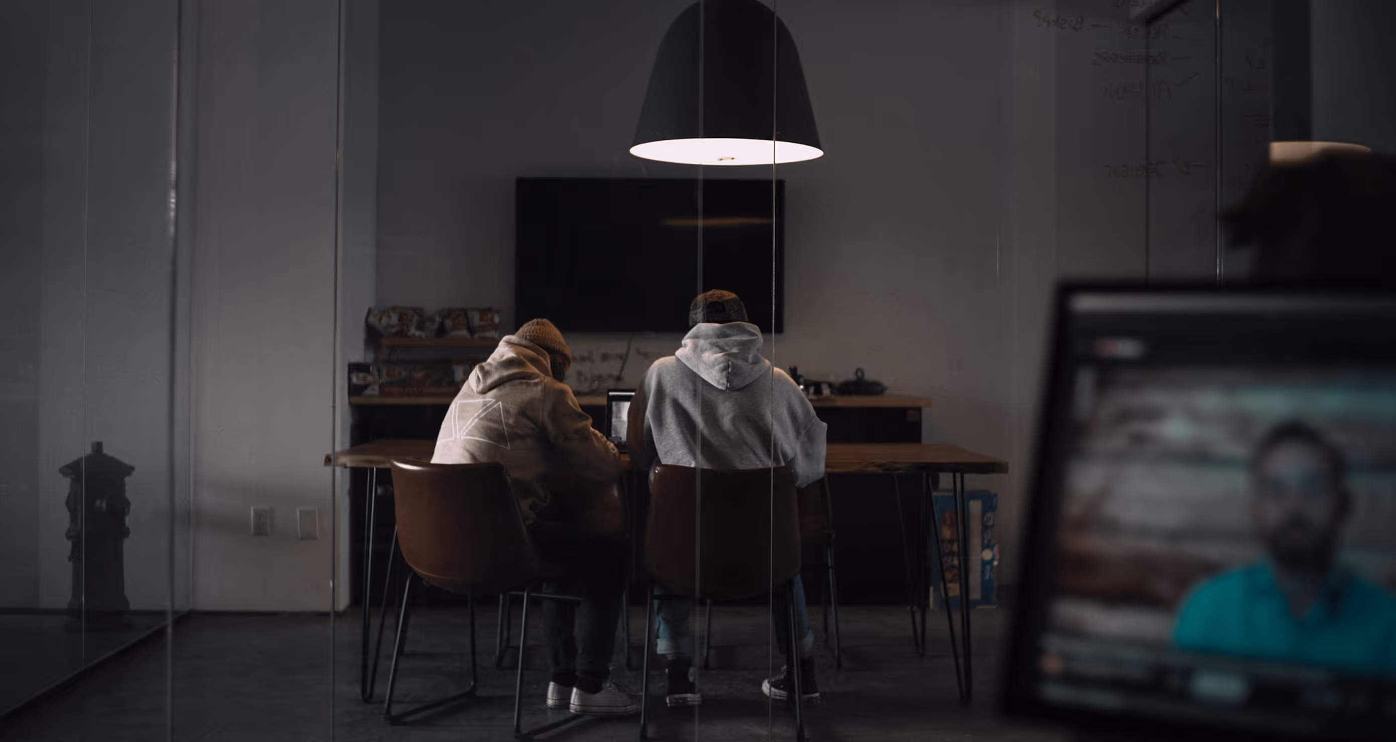 people sitting at a desk inside the office of Anthem Creative