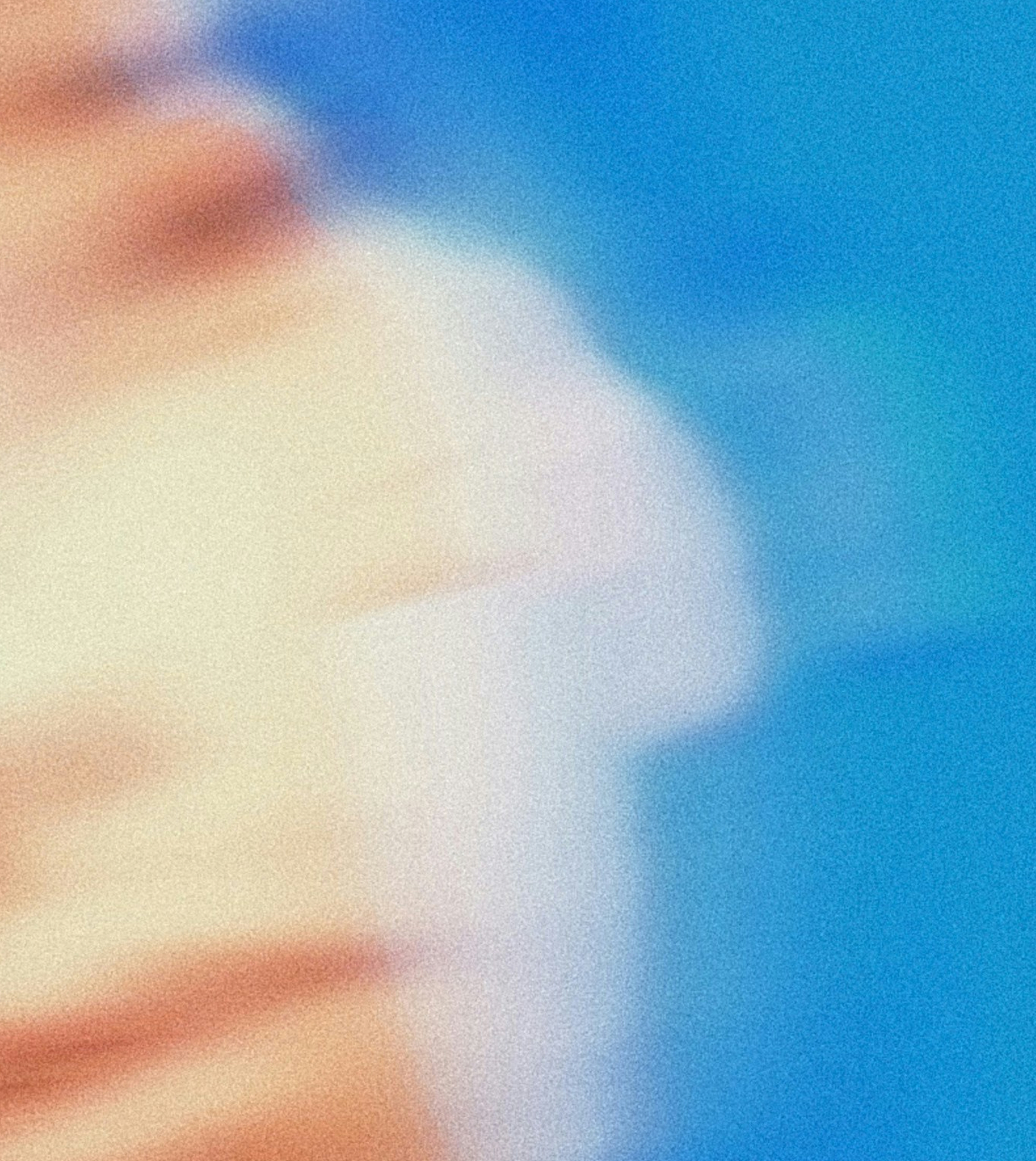 a blurred face on a blue background