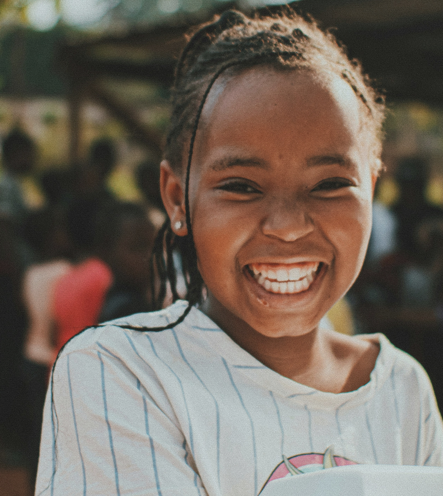 A girl smiles at the camera
