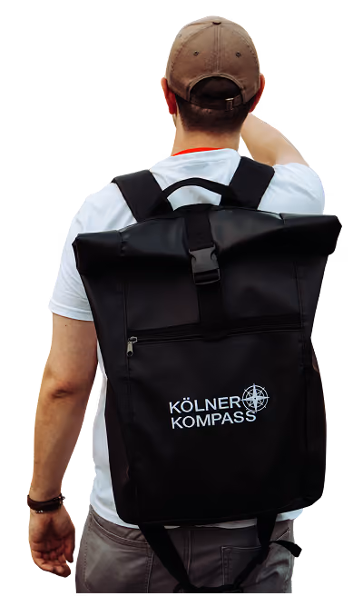 Kölner Kompass Tourguide von hinten mit Rucksack mit Logo