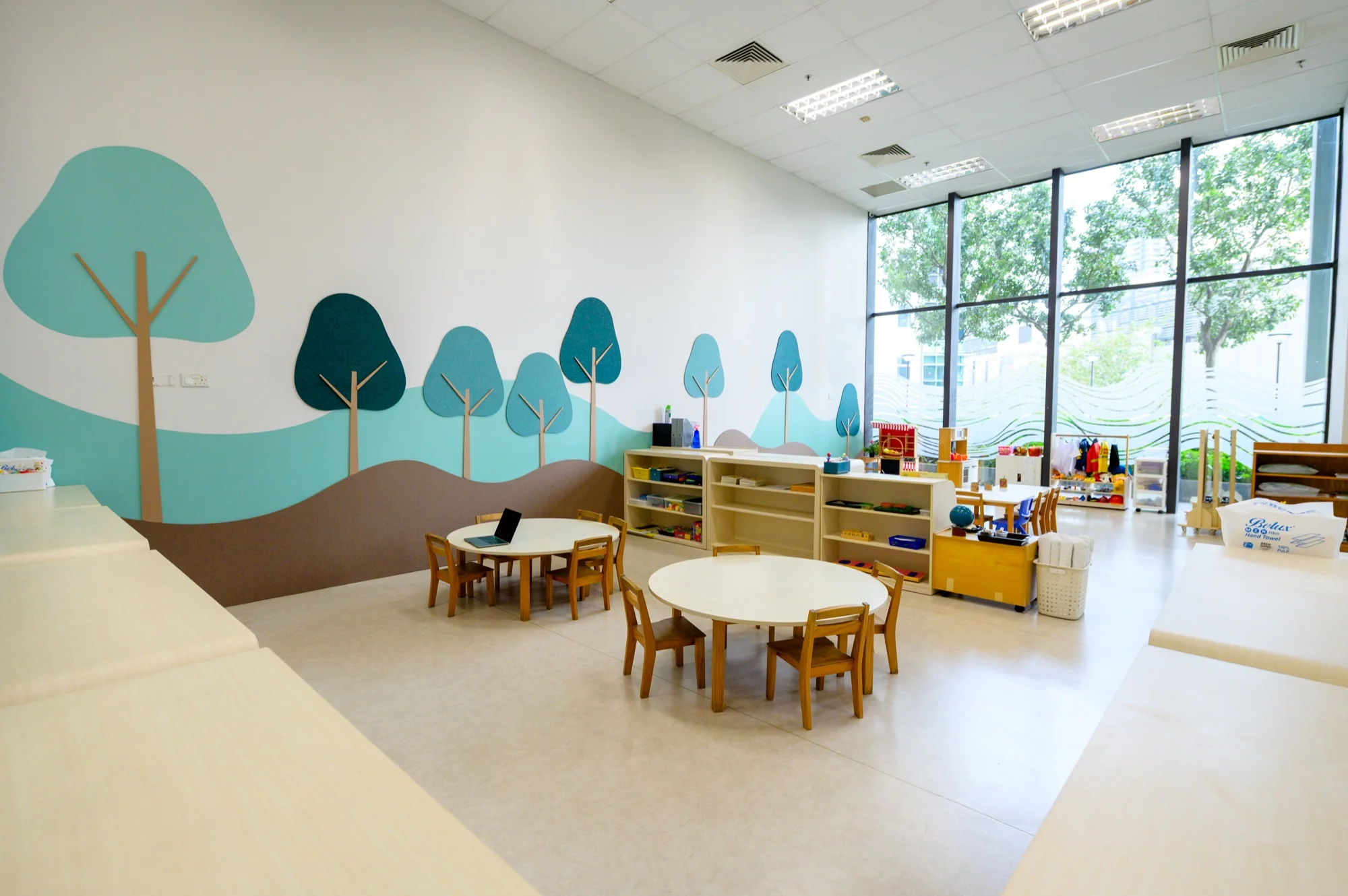 Children absorbed in their work inside a calm Josiah Montessori classroom