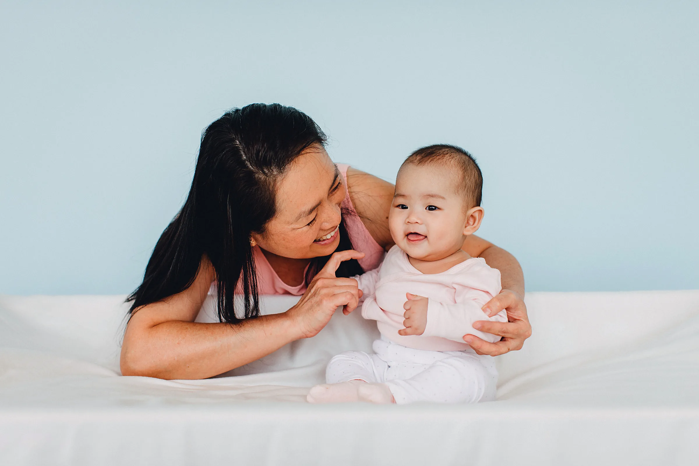 A Josiah caregiver supporting an infant during gentle one-to-one care.