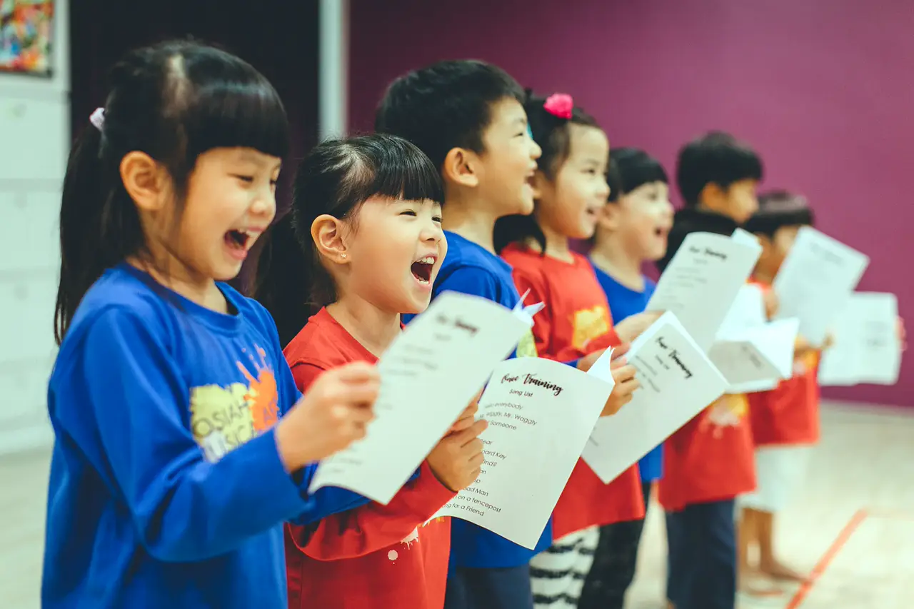 Josiah children singing together in a Music, Art & Performance (MAP) session.