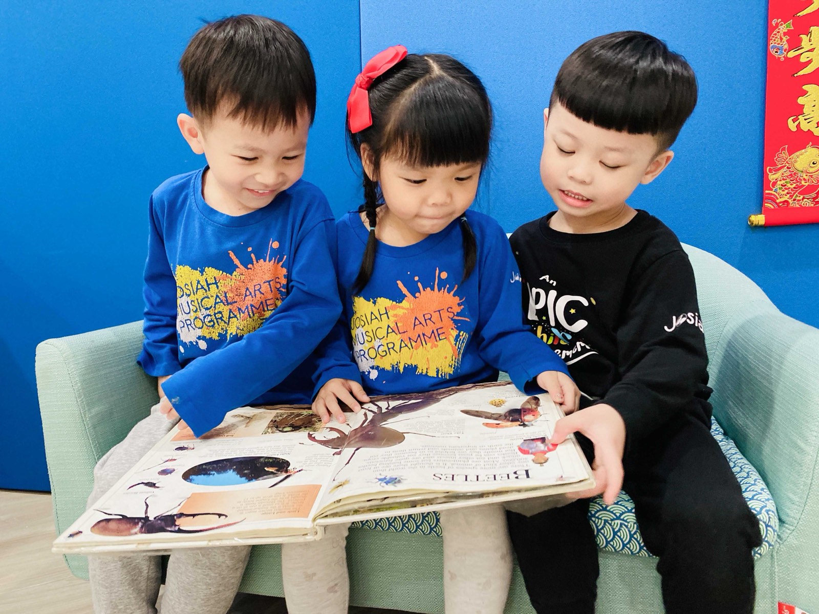 A child reading their first book in Josiah ACE Phonics