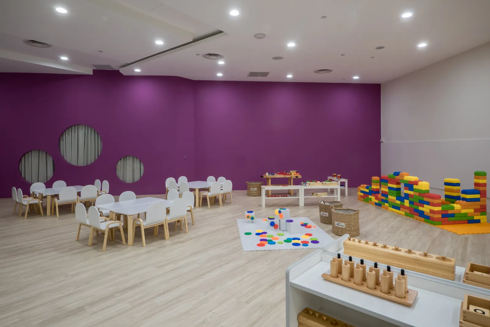 A kindergarten classroom at Suntec City, set up for the morning work cycle.