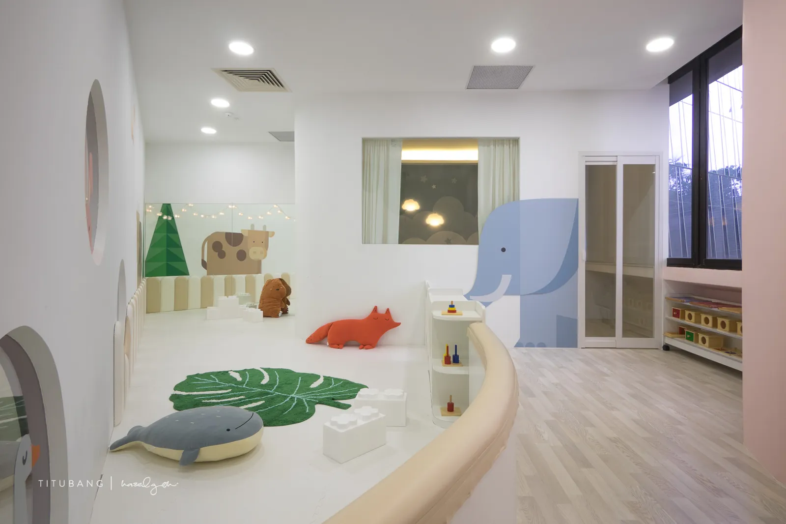The infant room at Raffles Place, with its soft floor and elephant wall.