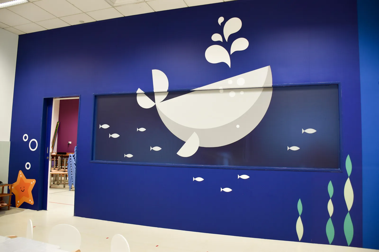 The whale wall at Josiah Montessori Changi Business Park.