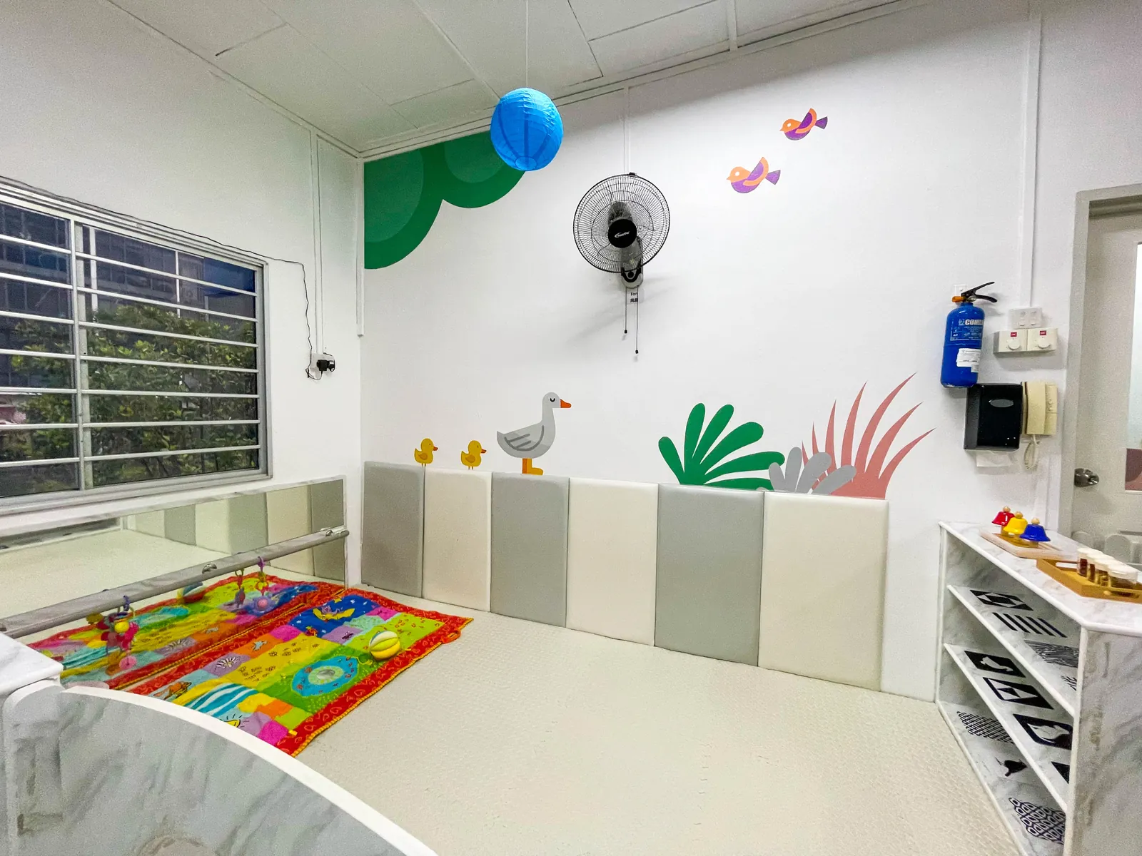 A ground-floor room at Pasir Ris, with windows along one wall.