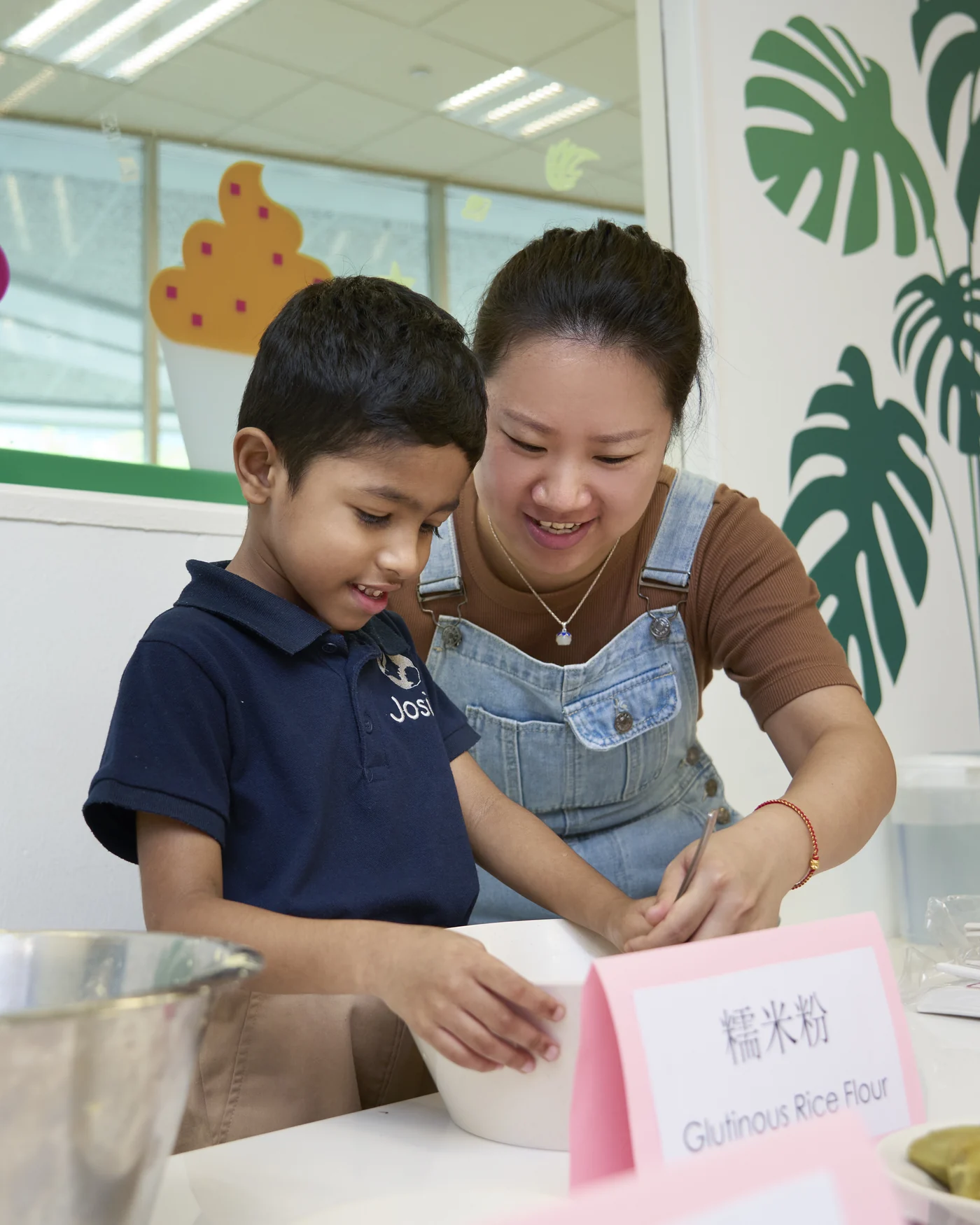 A hands-on food preparation activity at a Josiah Montessori centre.