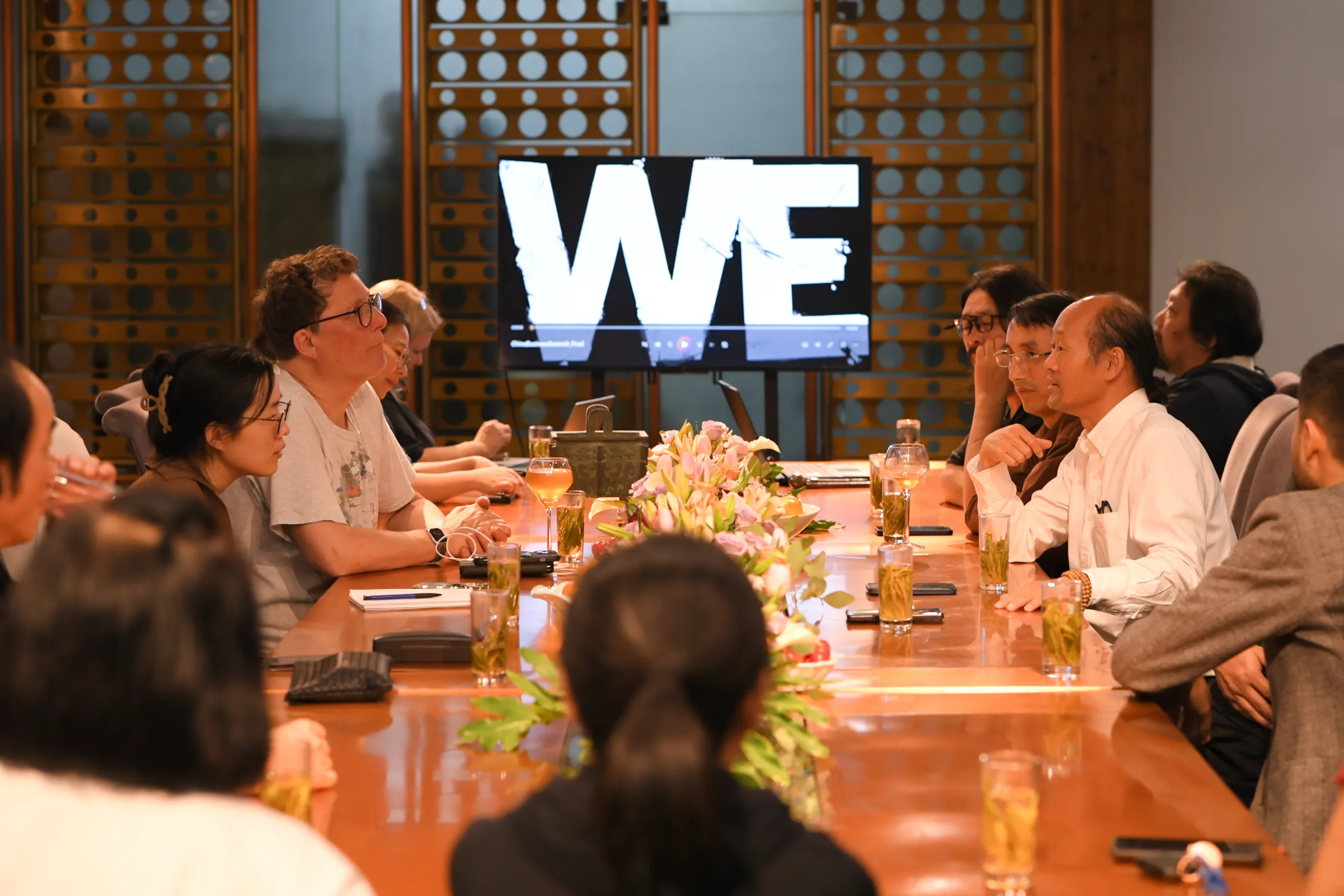 Artists and project team members participating in a creative salon.