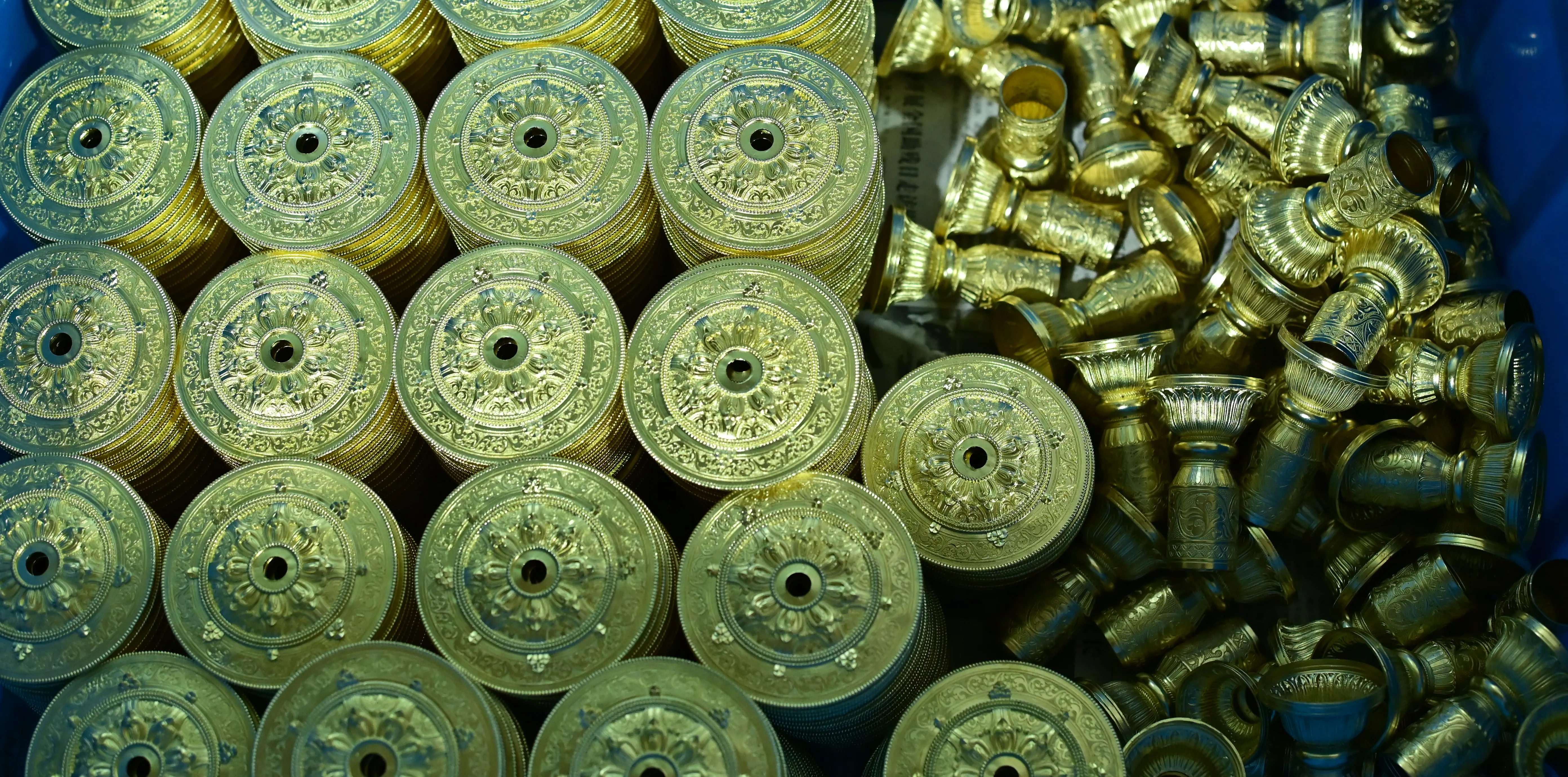 Detailed small-scale metal components prepared through precision plaster investment casting.