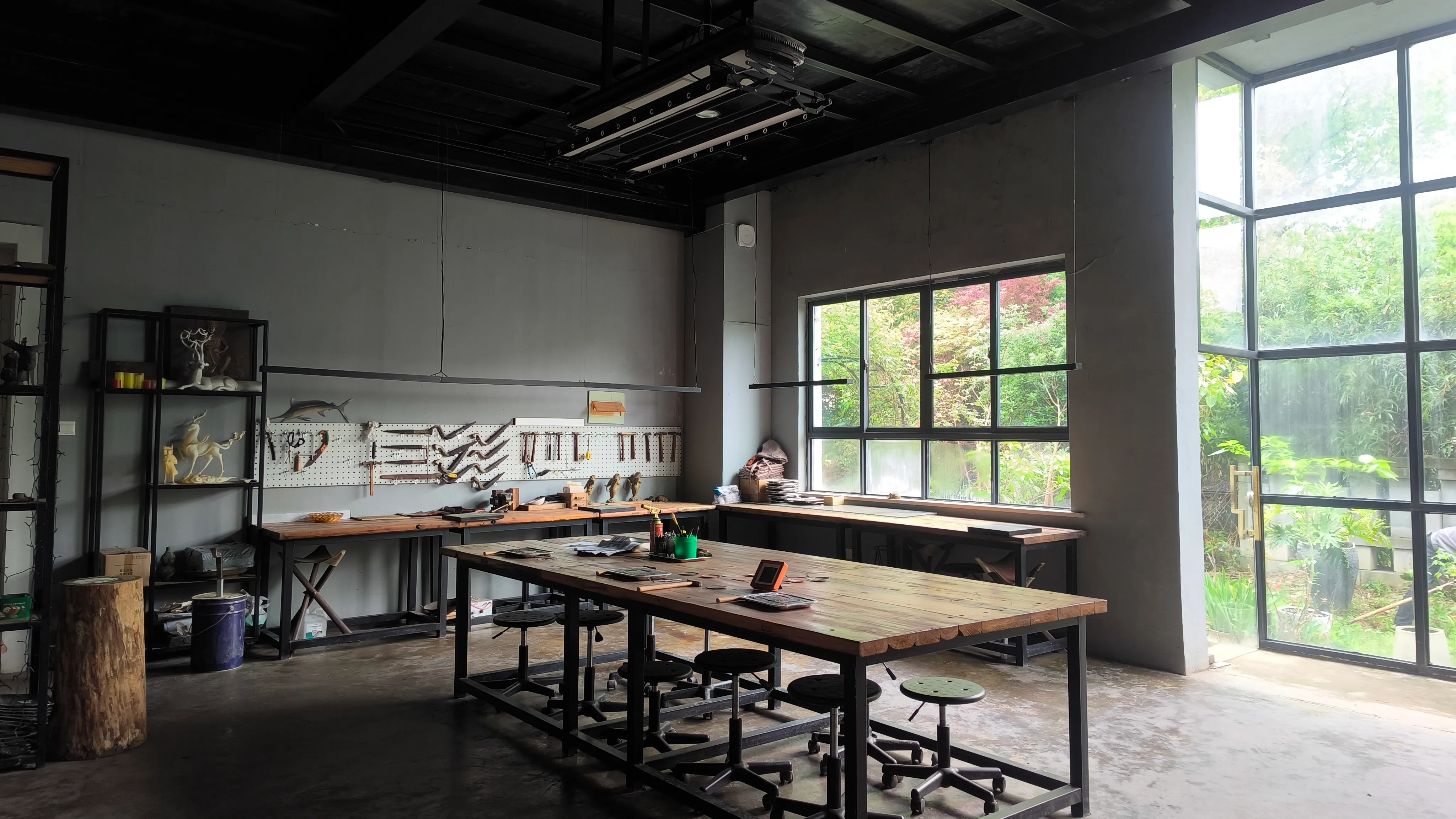 Multiple metal artworks progressing through production in the foundry.