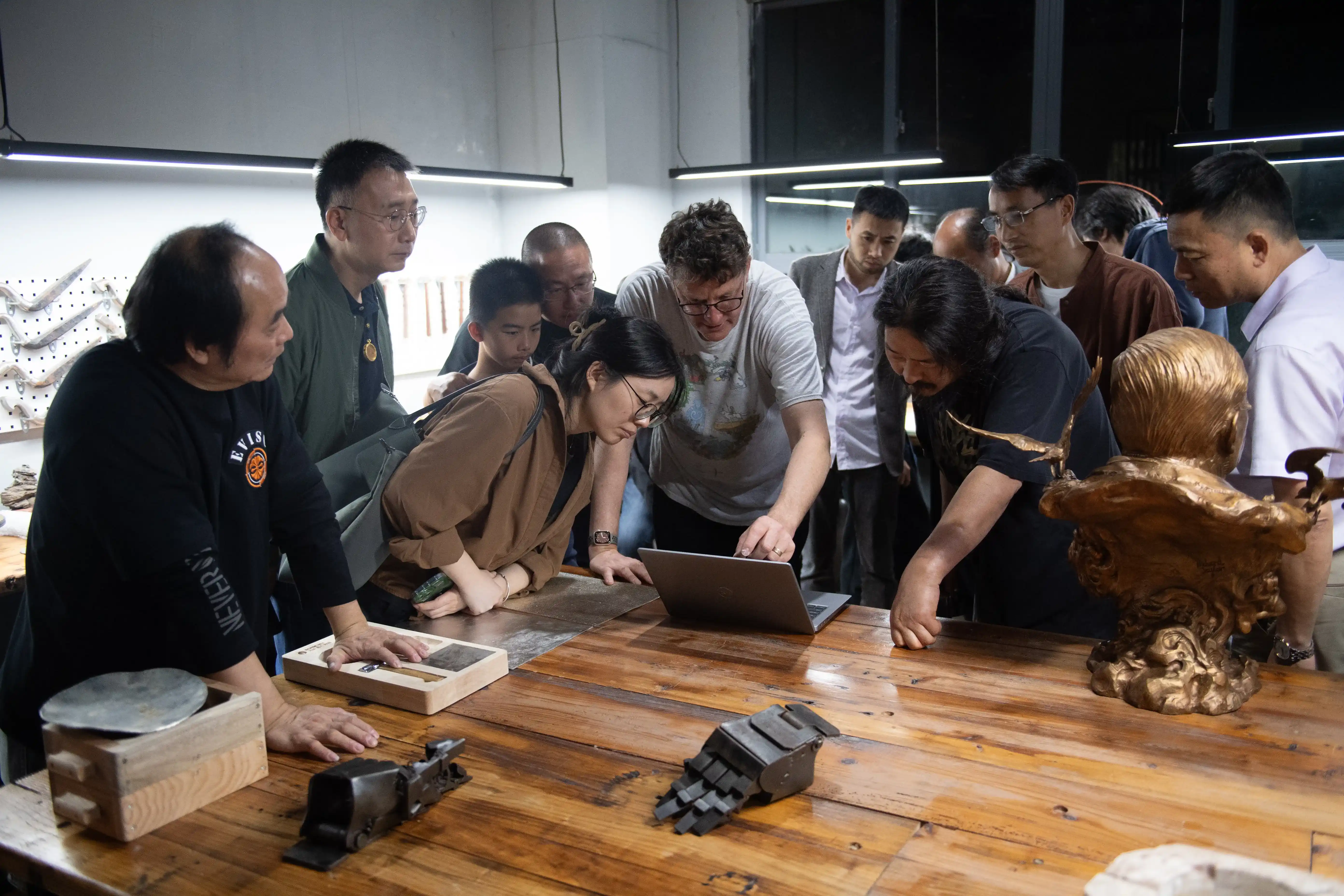 Project participants discussing artworks and creative practice in the studio.
