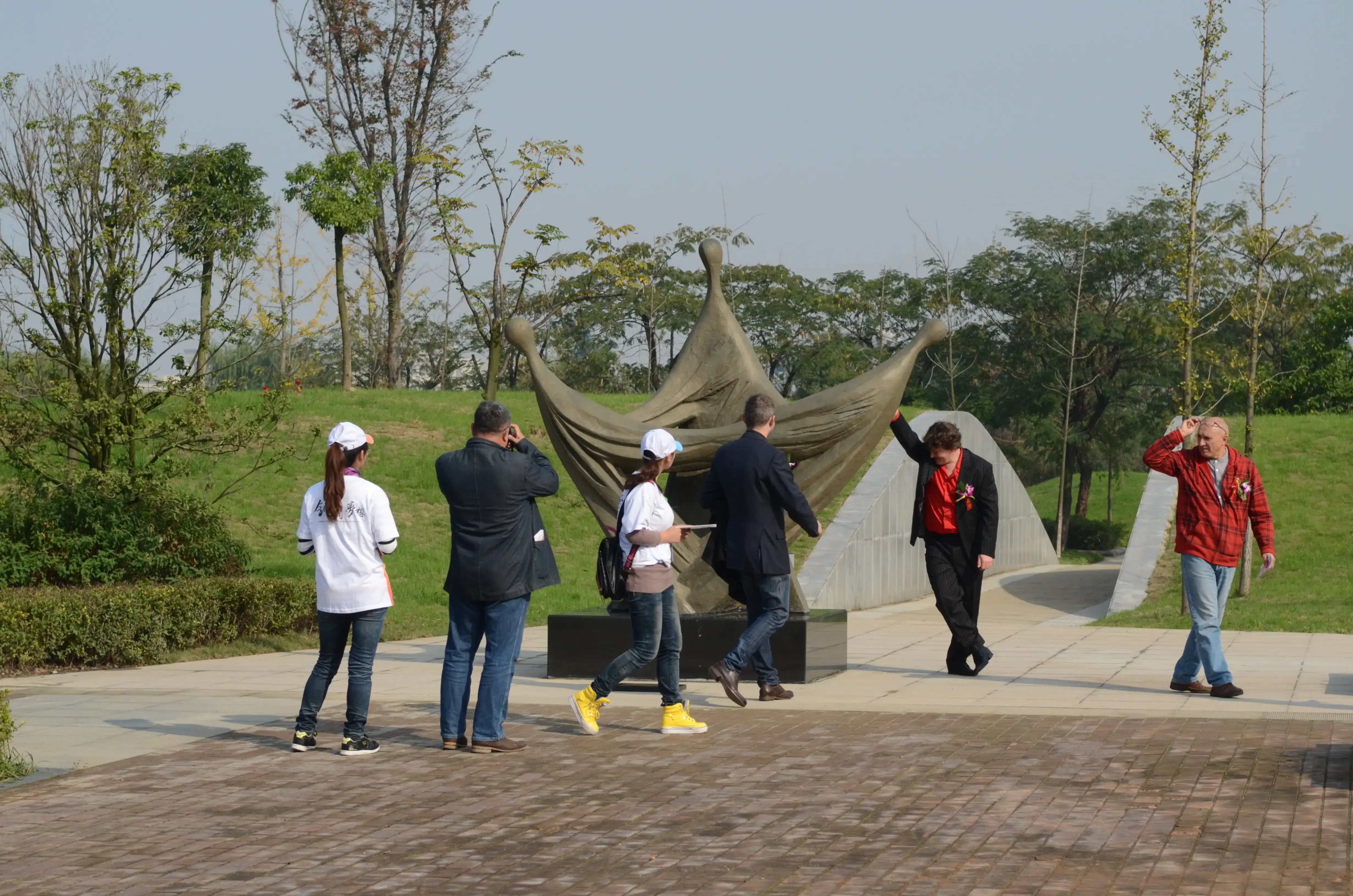Artists and project teams working together during an international sculpture symposium.