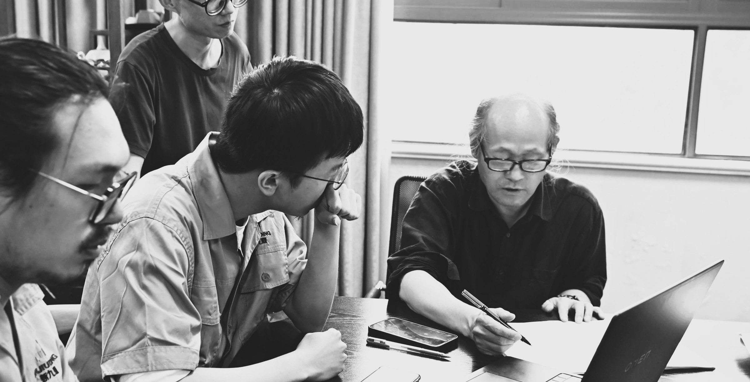 Design team reviewing sketches and project concepts together.