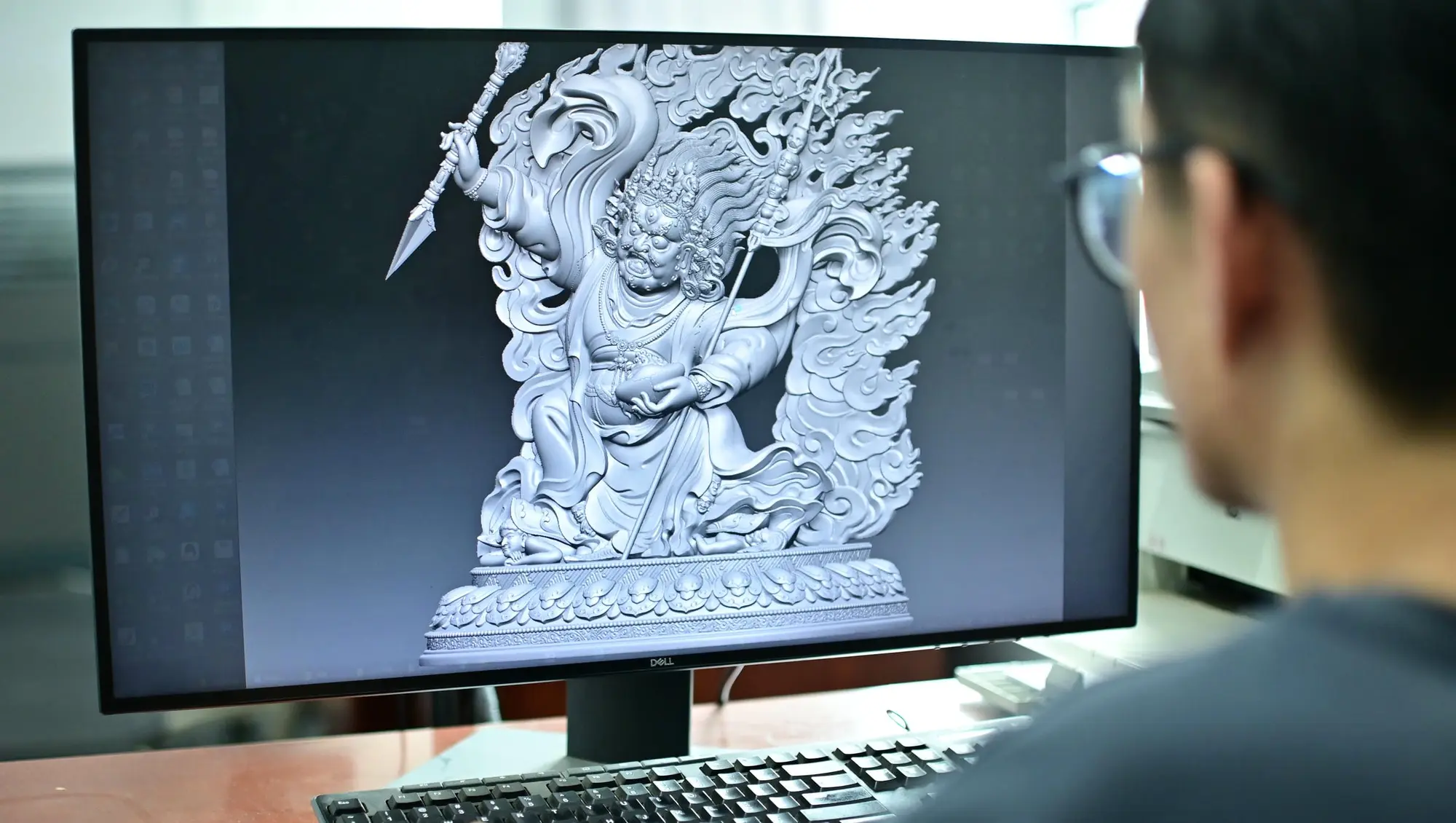 A detailed digital sculpture model under review on a professional workstation.