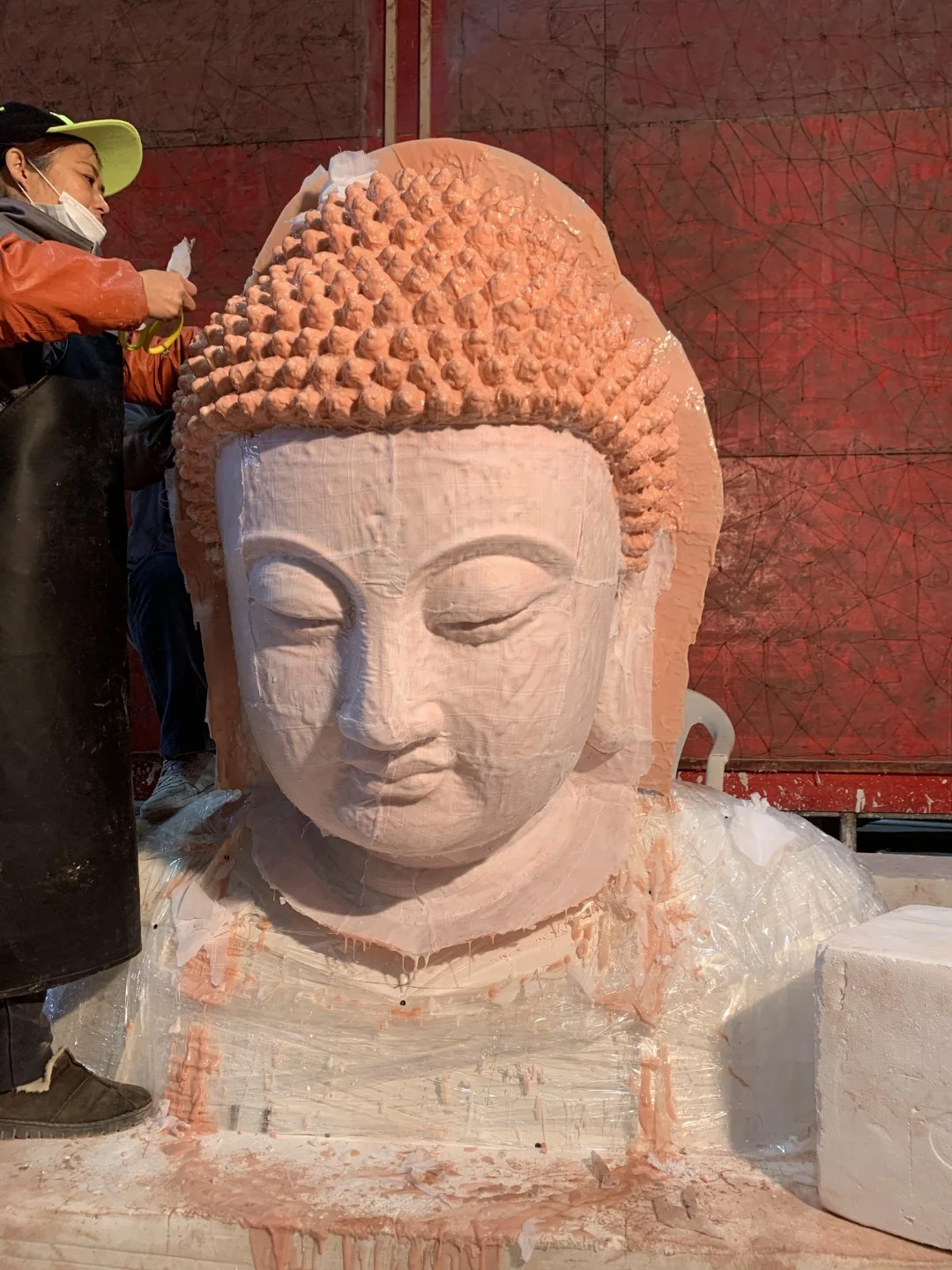 Close view of a silicone layer applied over a sculptural head