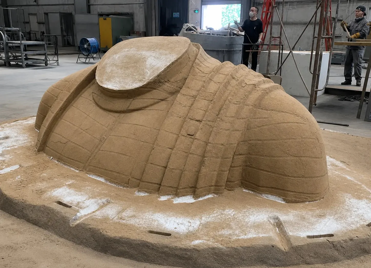 Compacted sand mould prepared around a large sculptural pattern
