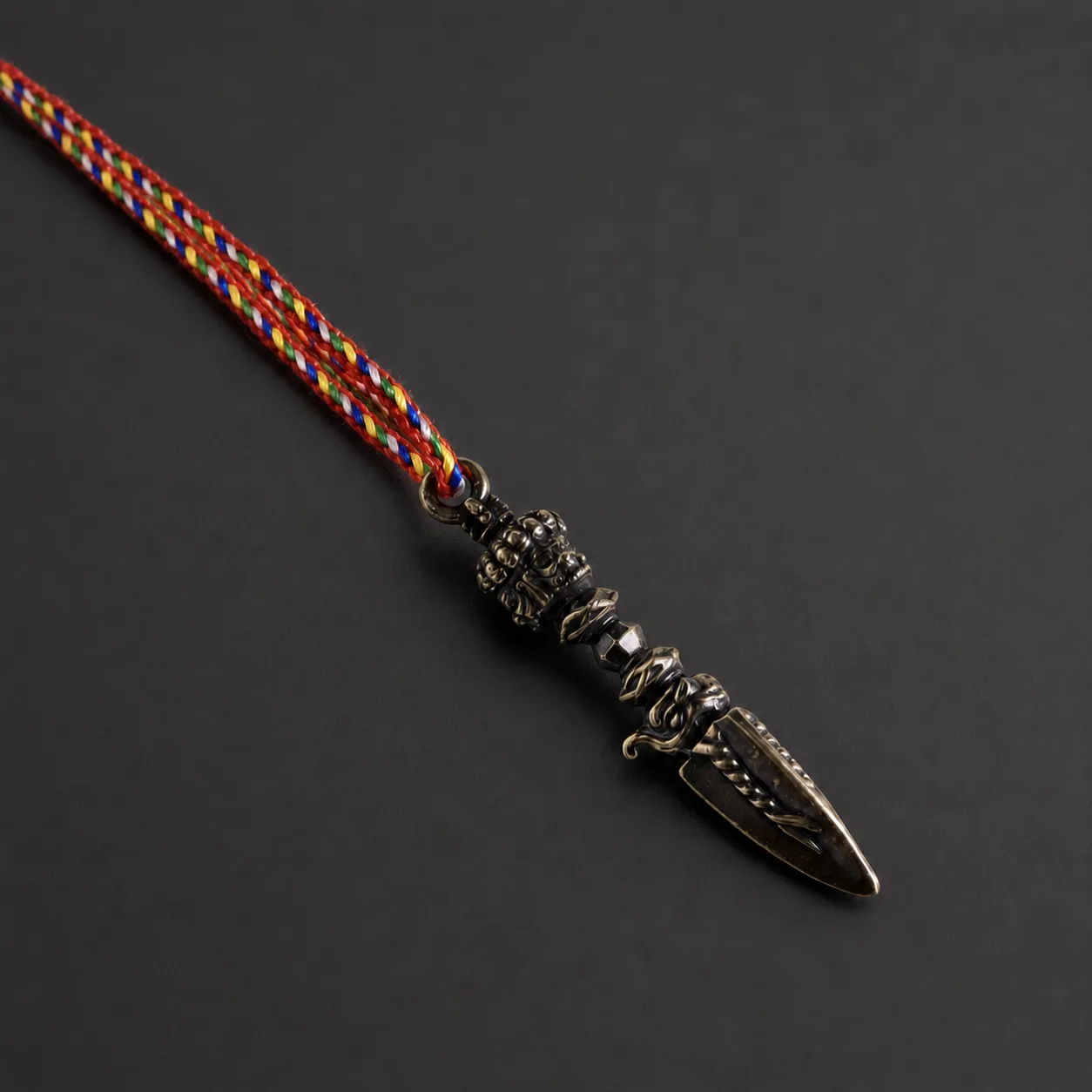 Vajra Pendant — The pendant on a braided cord
