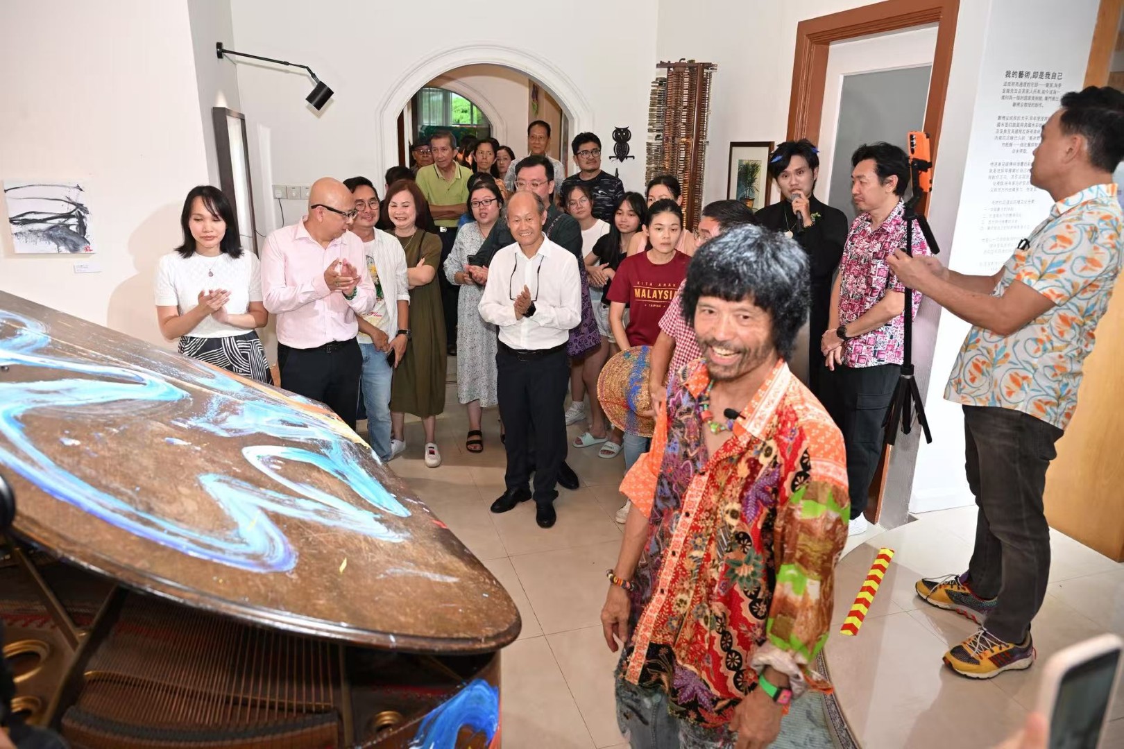 Guests gather among the artworks inside the gallery.