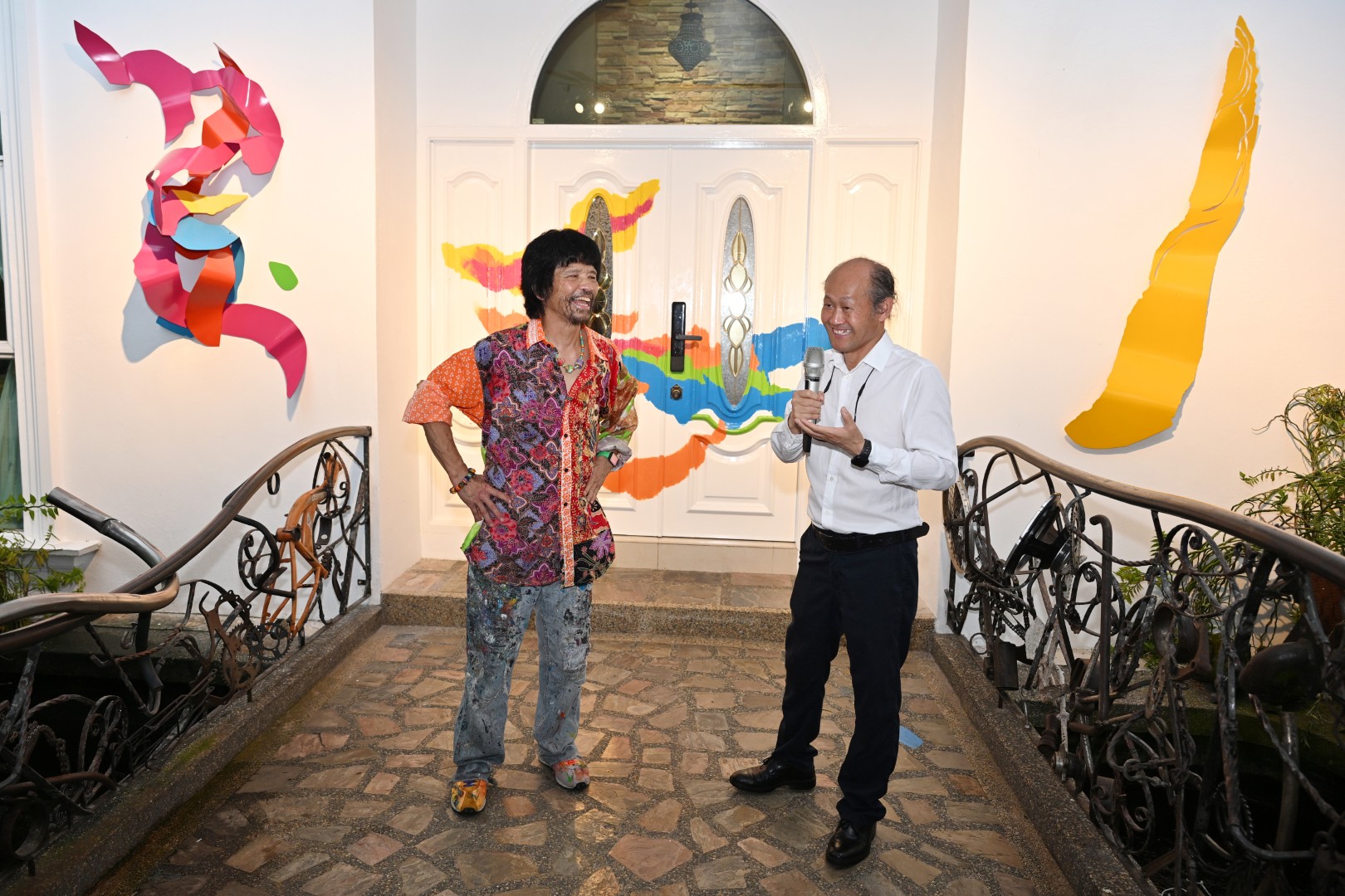 Artists and guests gather for the opening.