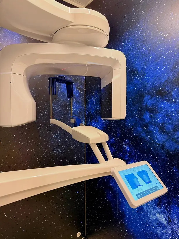 Close-up of dental scanning equipment with blue light in a clinic
