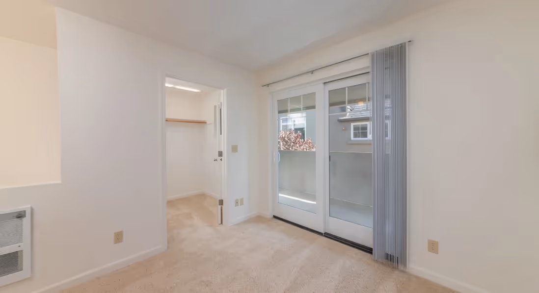 Living room with sliding door and closet