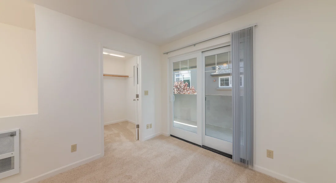 Living room with sliding door and closet