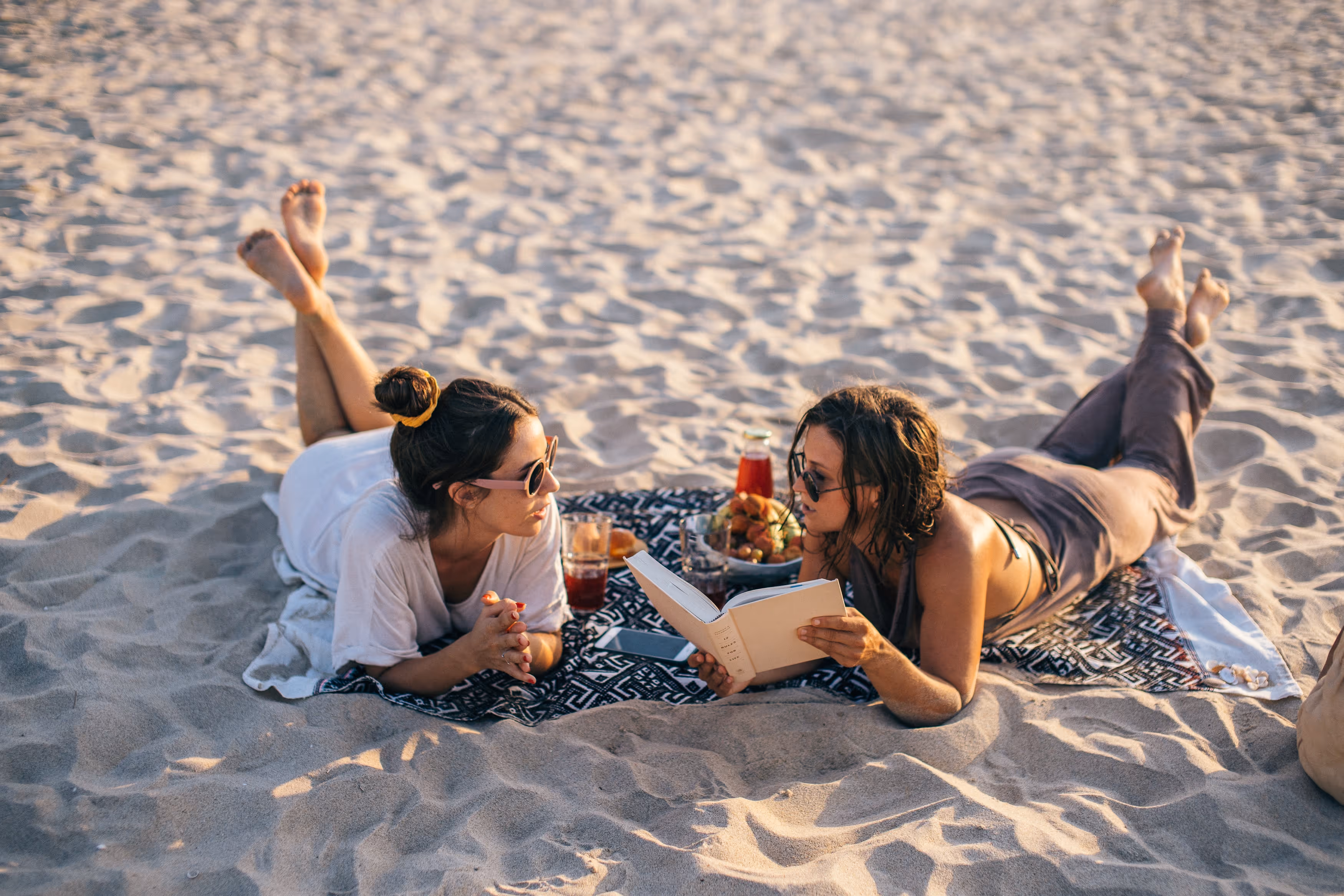 Two girls at the beach stock image