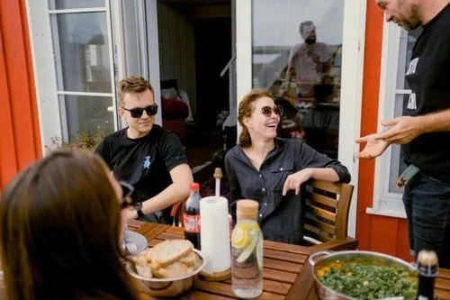 Group of friends smiling at waiter