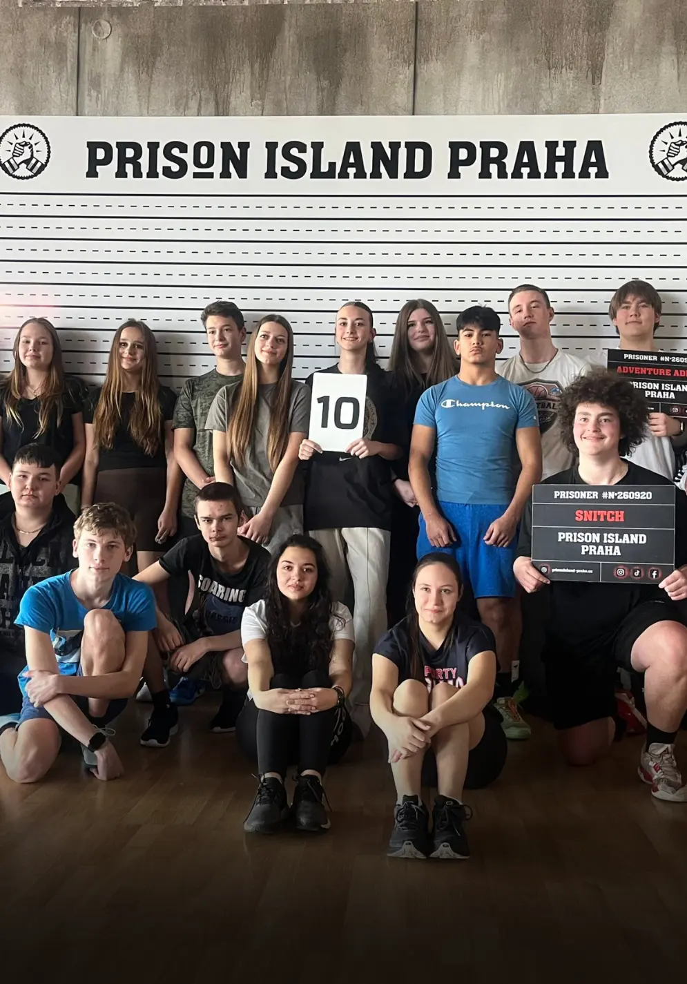 Exterior of the Prison Island Praha building with glass facade and branded signage