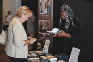 Lady buying a book  at Faith Christian Fellowship