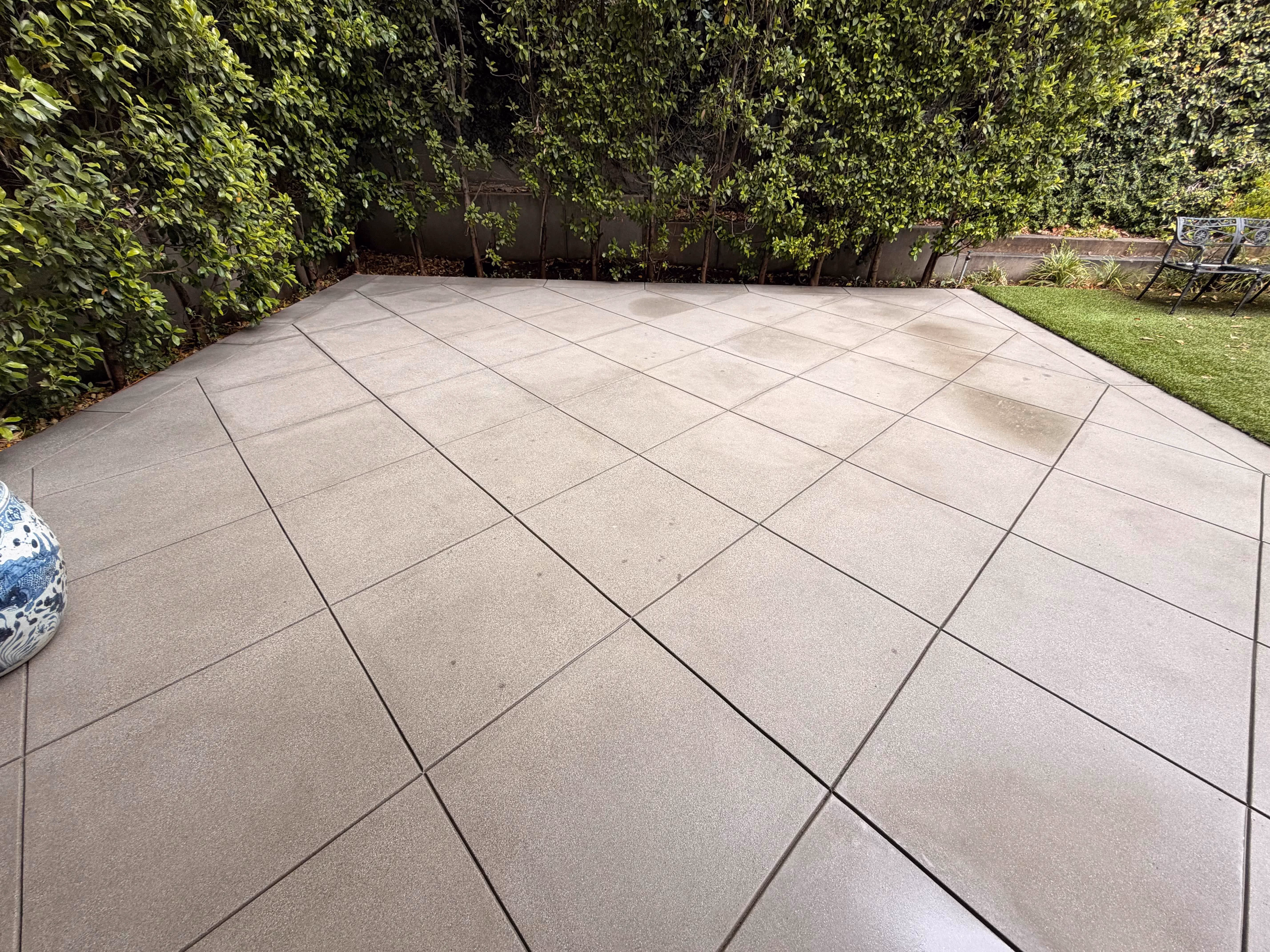 Clean concrete patio after pressure washing by Rexterior in Pasadena