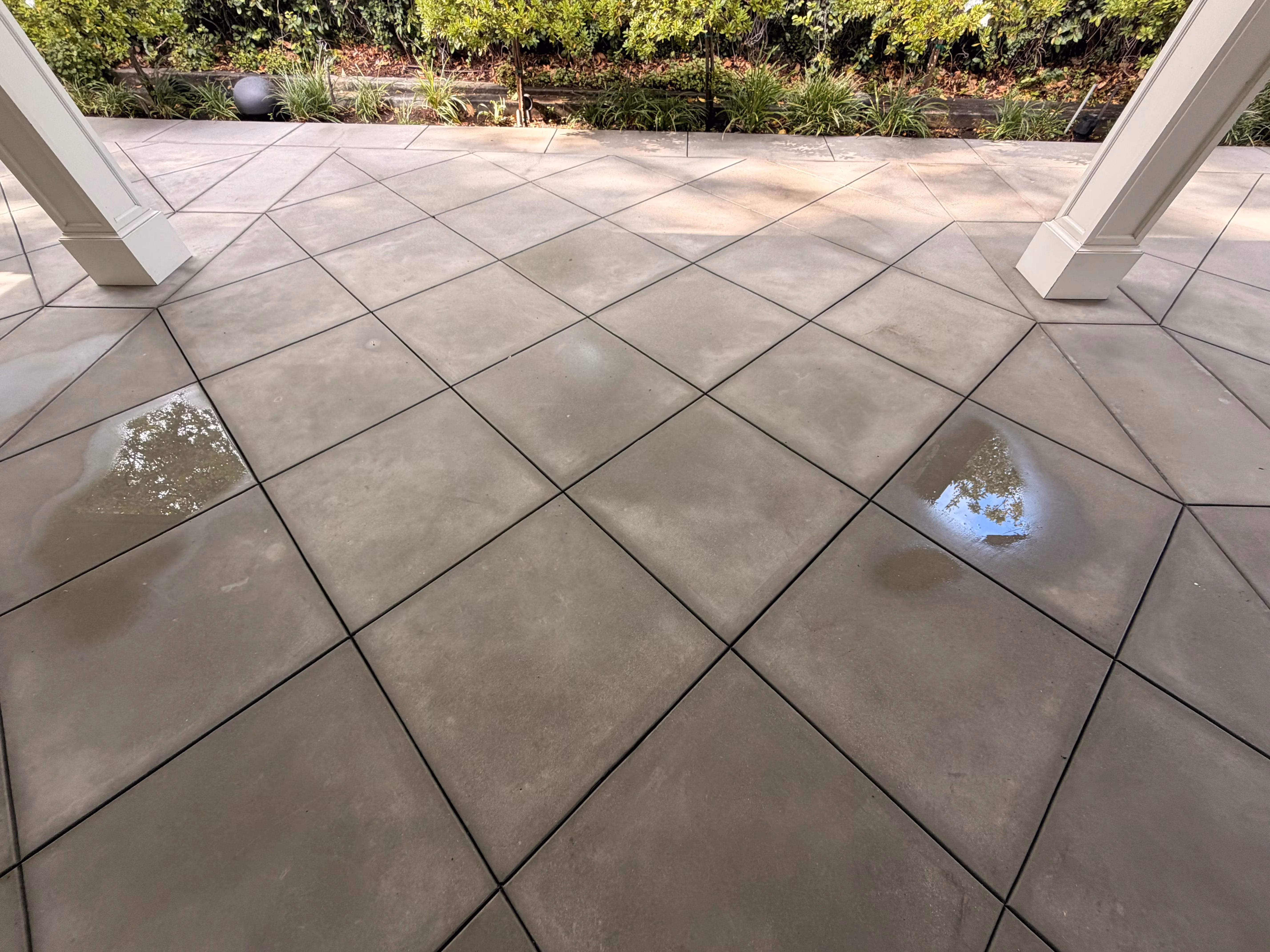 Clean concrete driveway after pressure washing by Rexterior in Pasadena