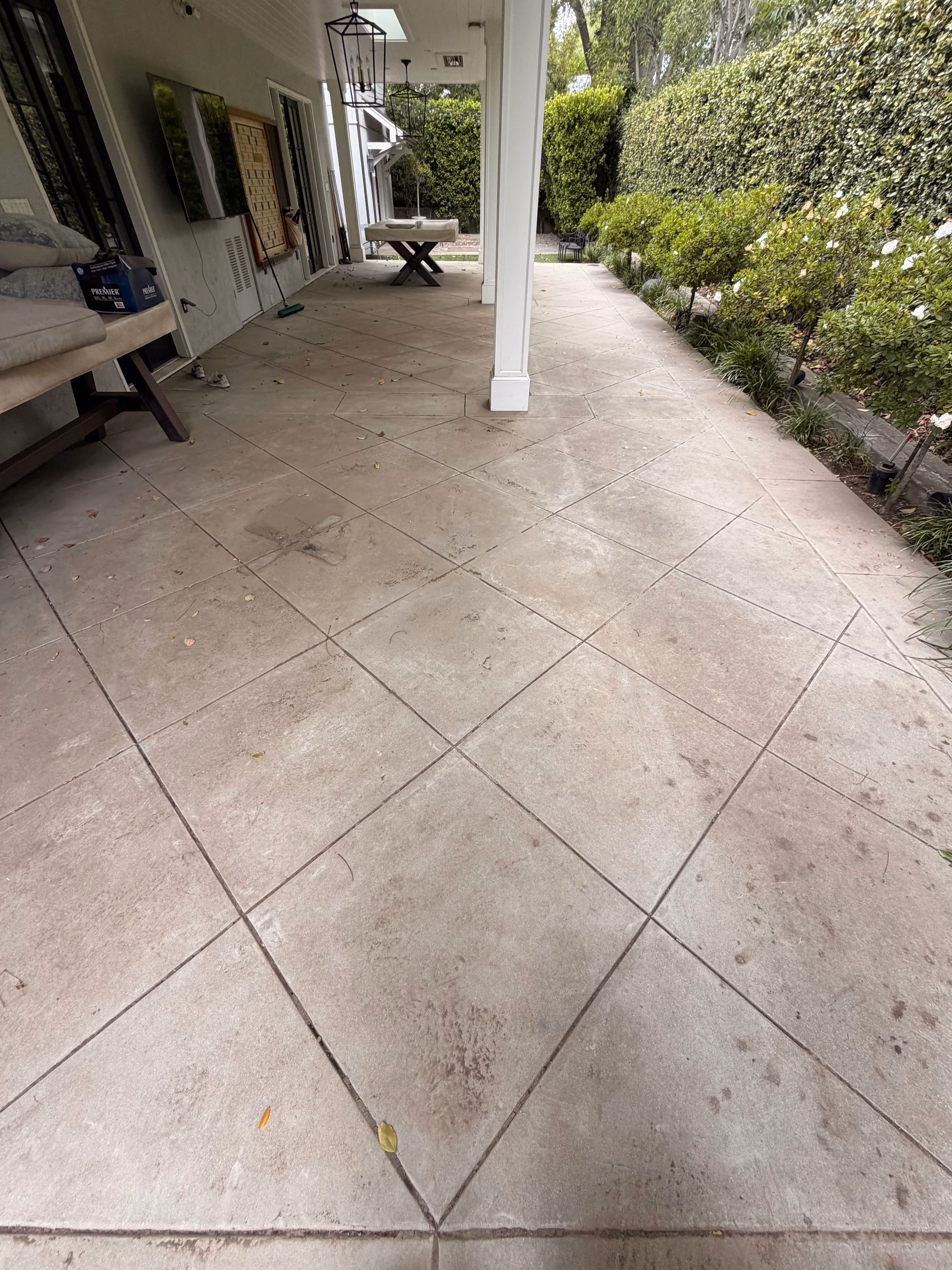 Dirty covered patio before pressure washing in Pasadena