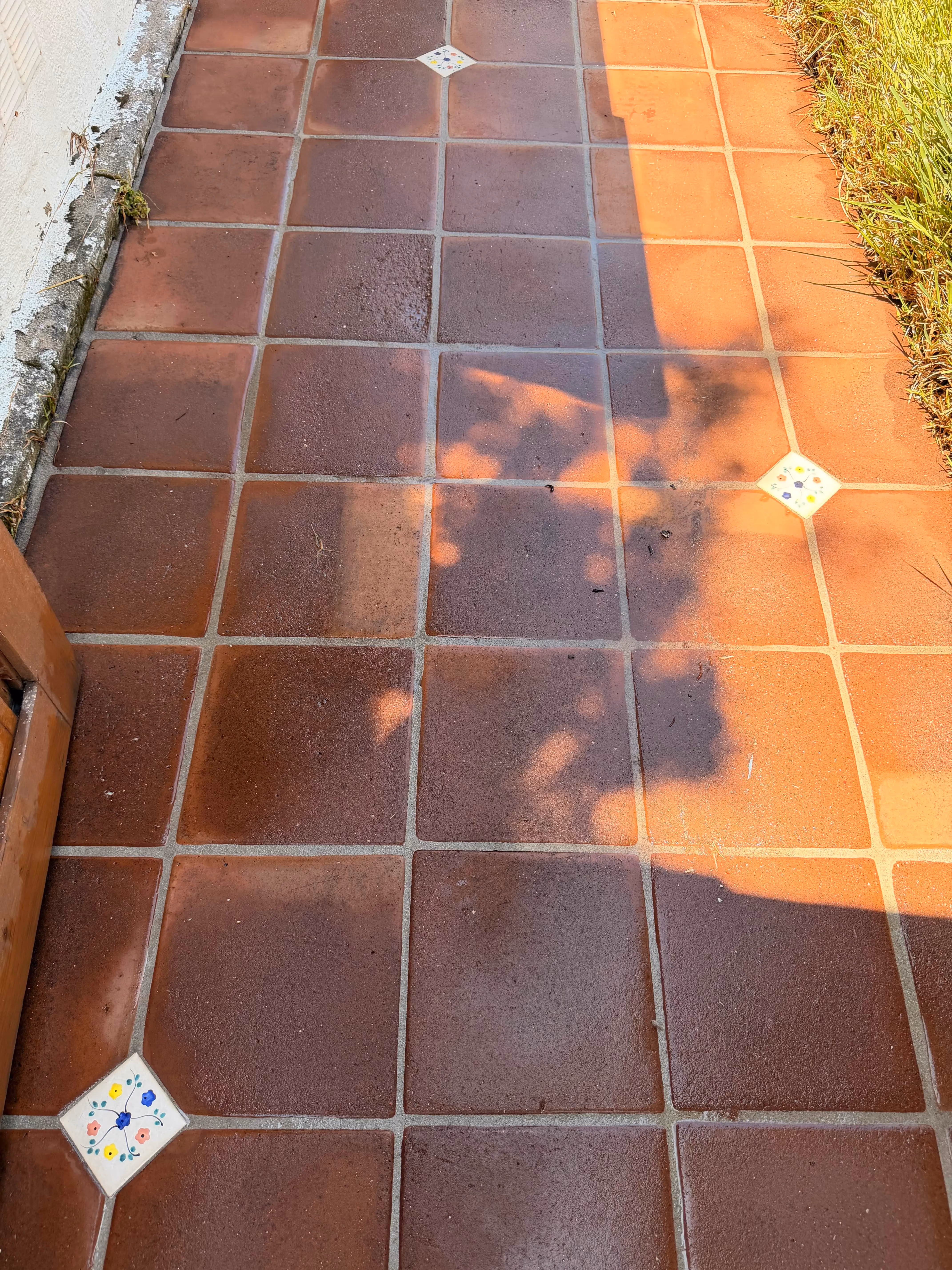 Clean red tile patio after pressure washing by Rexterior in Pasadena