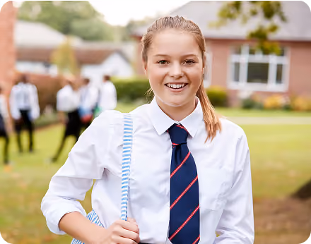 Smiling student in uniform after IQ testing for Bay Area schools and gifted programs
