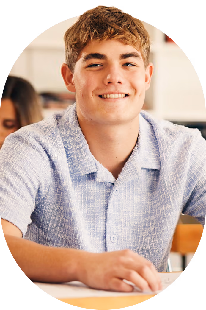 A smiling teenage student in high school who received a clear roadmap from an FASD evaluation