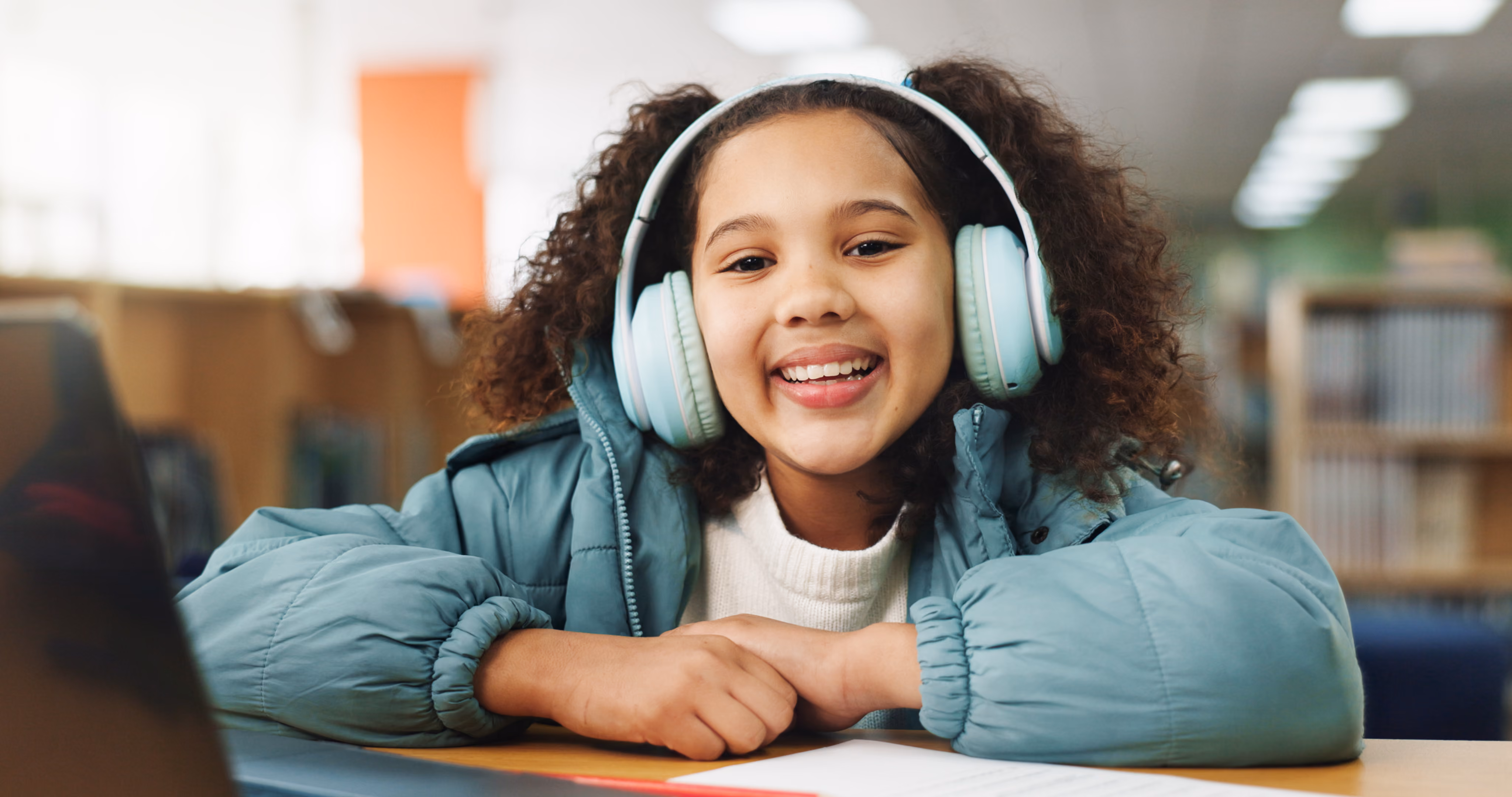 A child smiling while working on a learning activity during a psychoeducational evaluation in San Diego